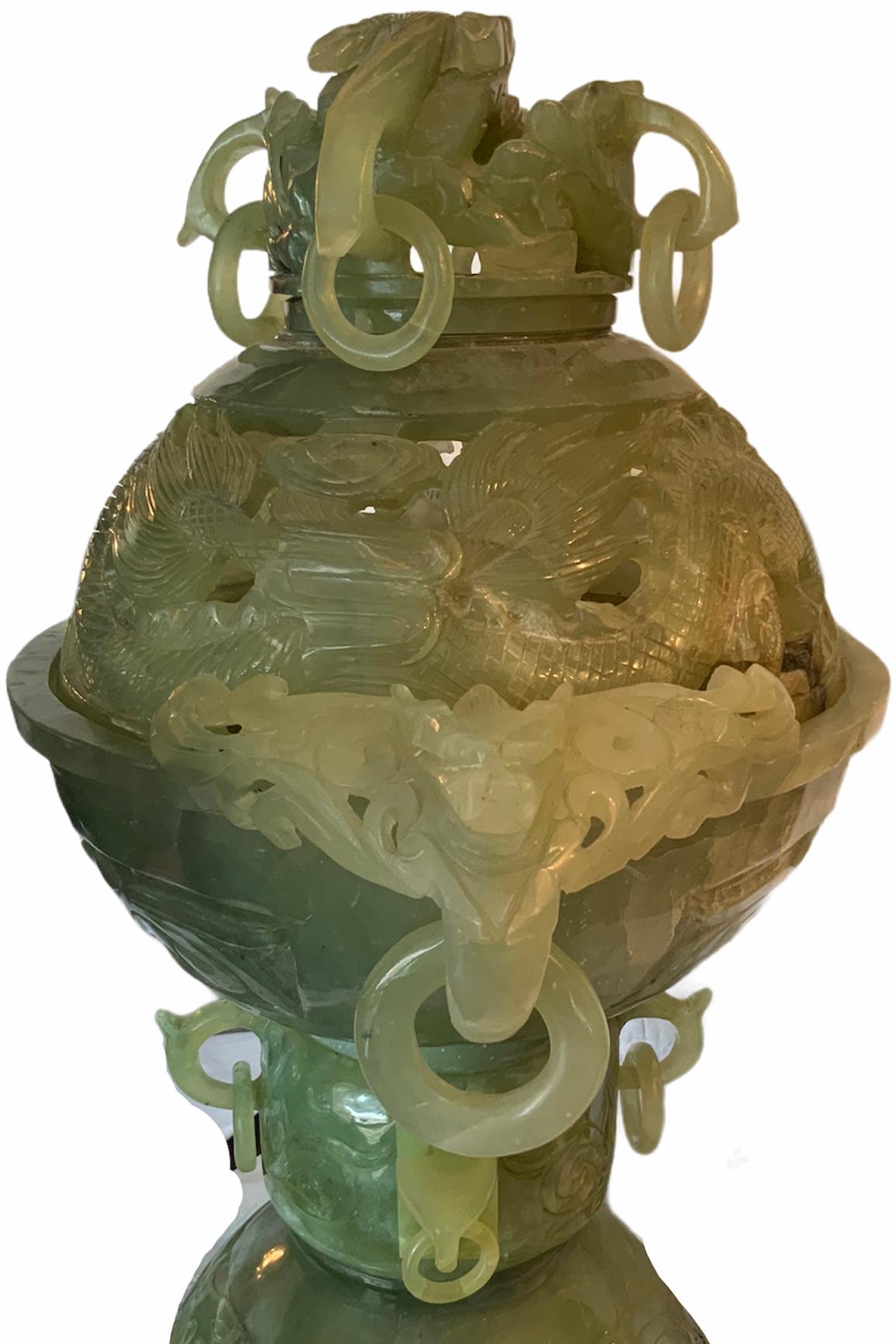 An exceptional chinese jade like stone  large heavy incense burner. The jade like stone depicts different shades of green and that is what made this piece more rare. It is built in three pieces: the crown lid, the bowl and the pedestal. All of them