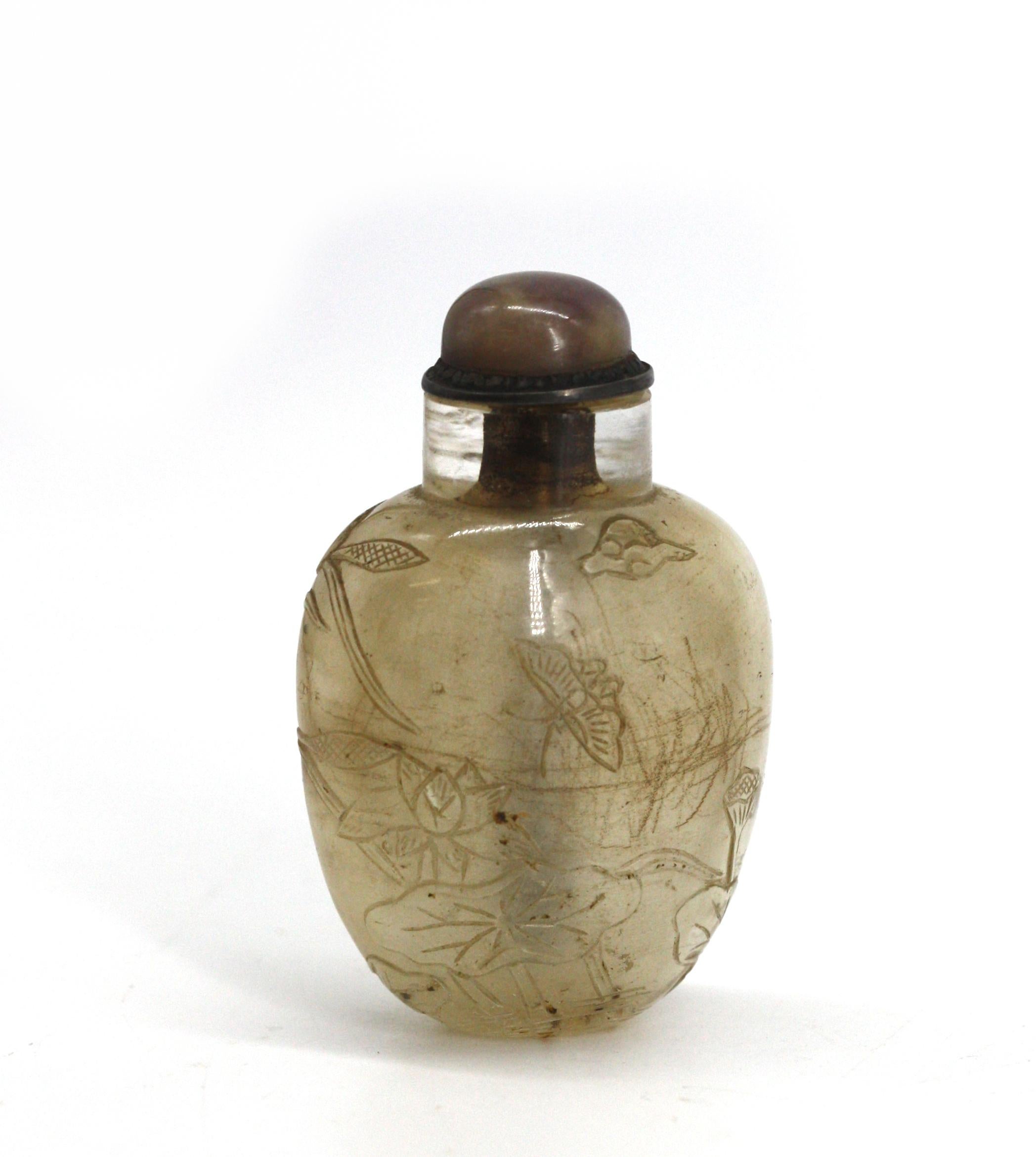 
Snuff bottle cinese in cristallo di rocca intagliato
Il corpo ovale intagliato con fogliame di palude, con fratture interne, tappo in quarzo con paletta in metallo.
Altezza 2,5 pollici.
Rapporto sulle condizioni
Buone condizioni.