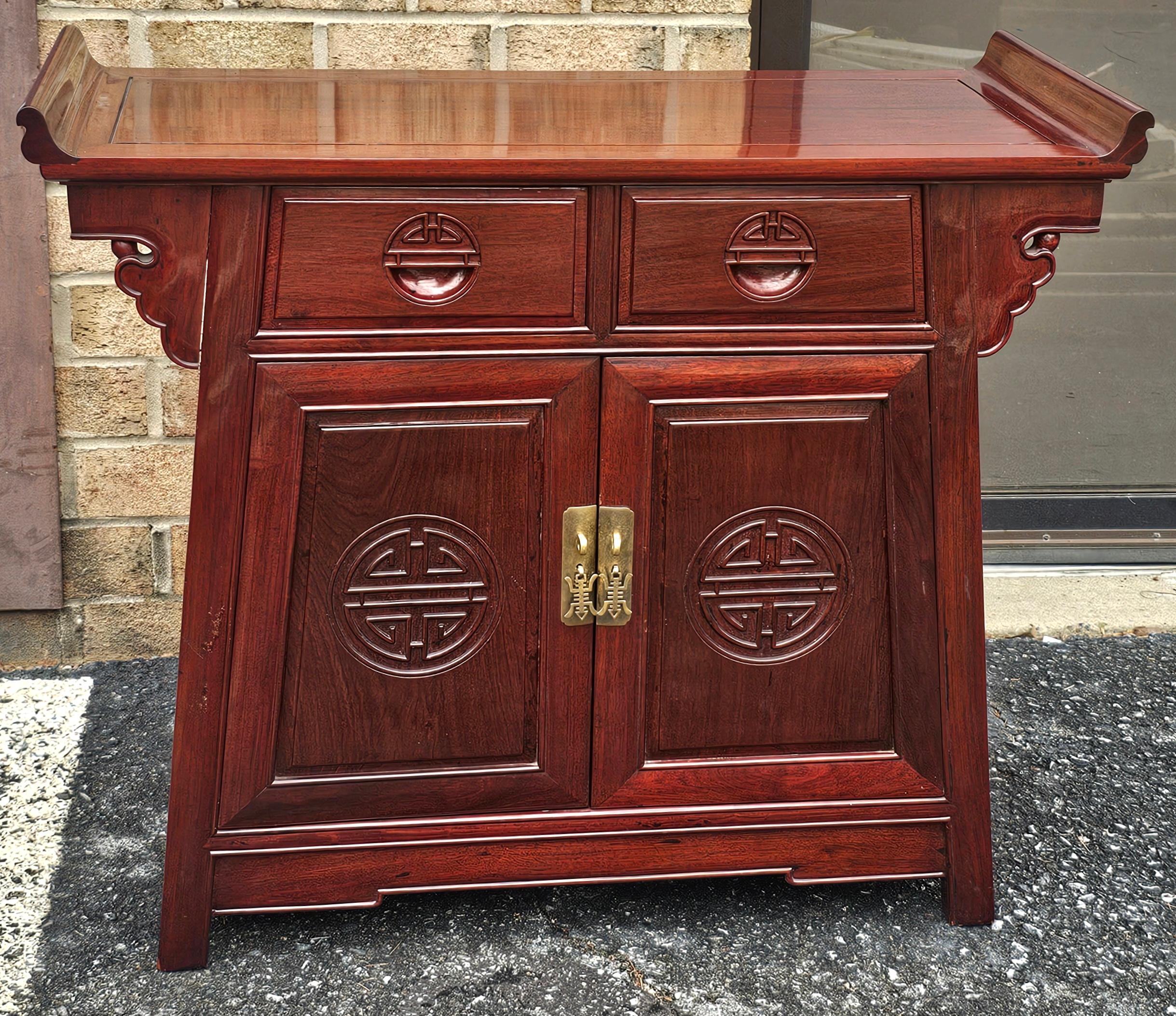 A Chinese Carved Rosewood Altar Form Side Cabinet
Measures 37.5