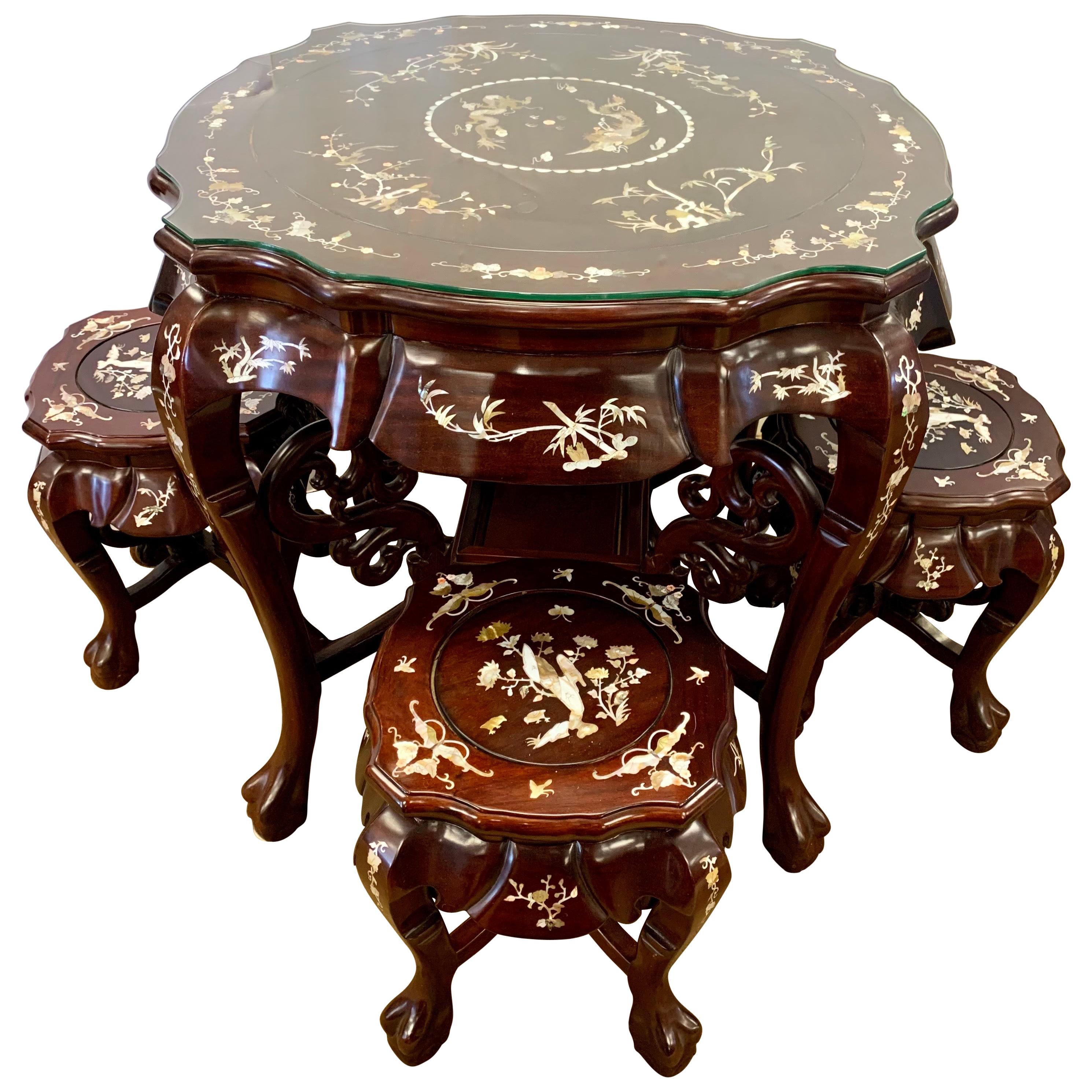 Chinese Carved Rosewood and Mother-of-Pearl Set, Tea Table and Four Stools