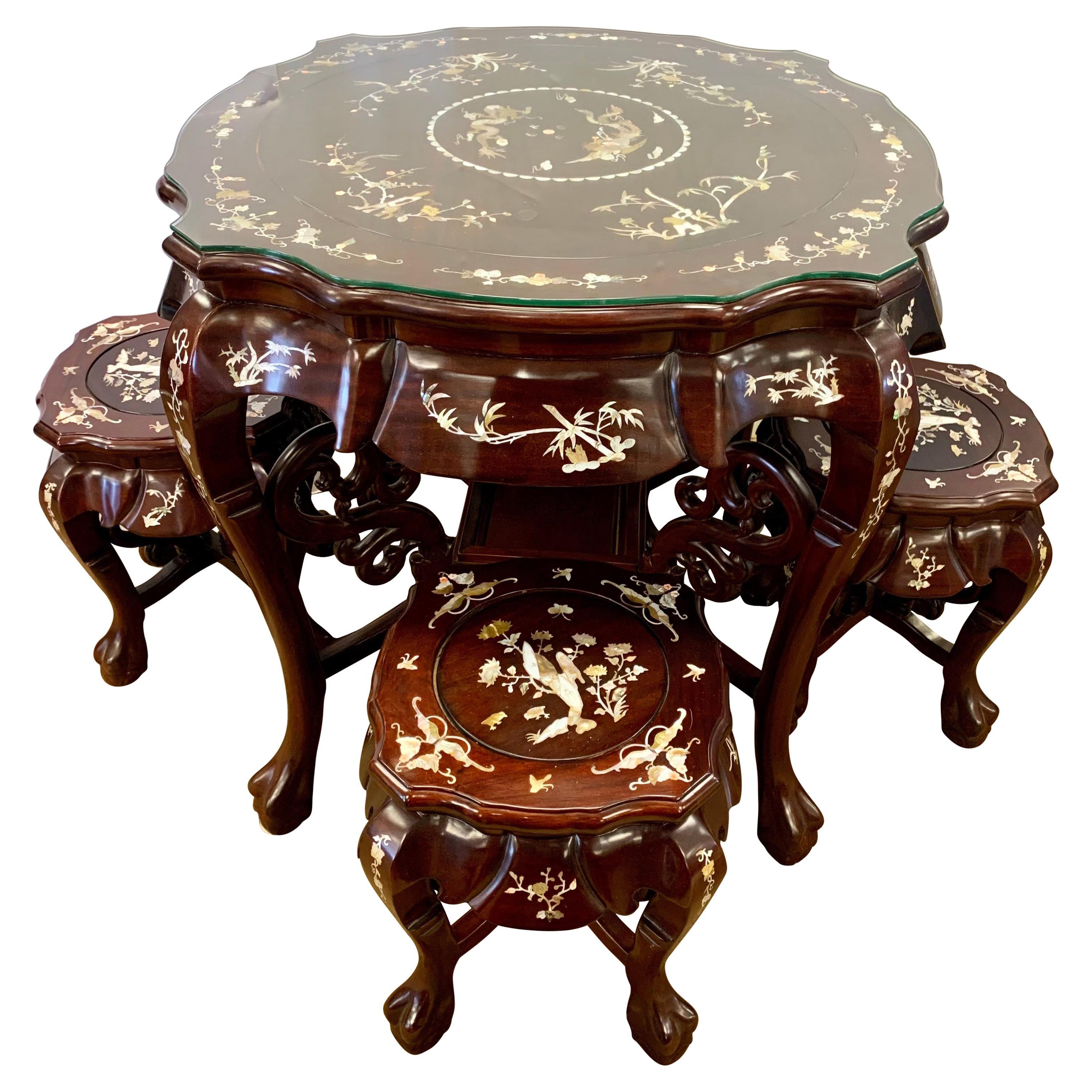 Chinese Carved Rosewood and Mother-of-Pearl Set, Tea Table and Four Stools