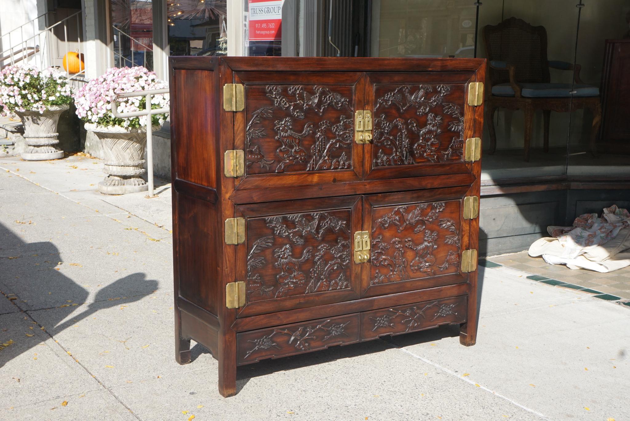 This cabinet made circa 1950, is of the finest craftsmanship. Done in the traditional Chinese method of interlocking chamfered construction it can be, if desired, completely broken down and refitted together without use of glues or fasteners.
All