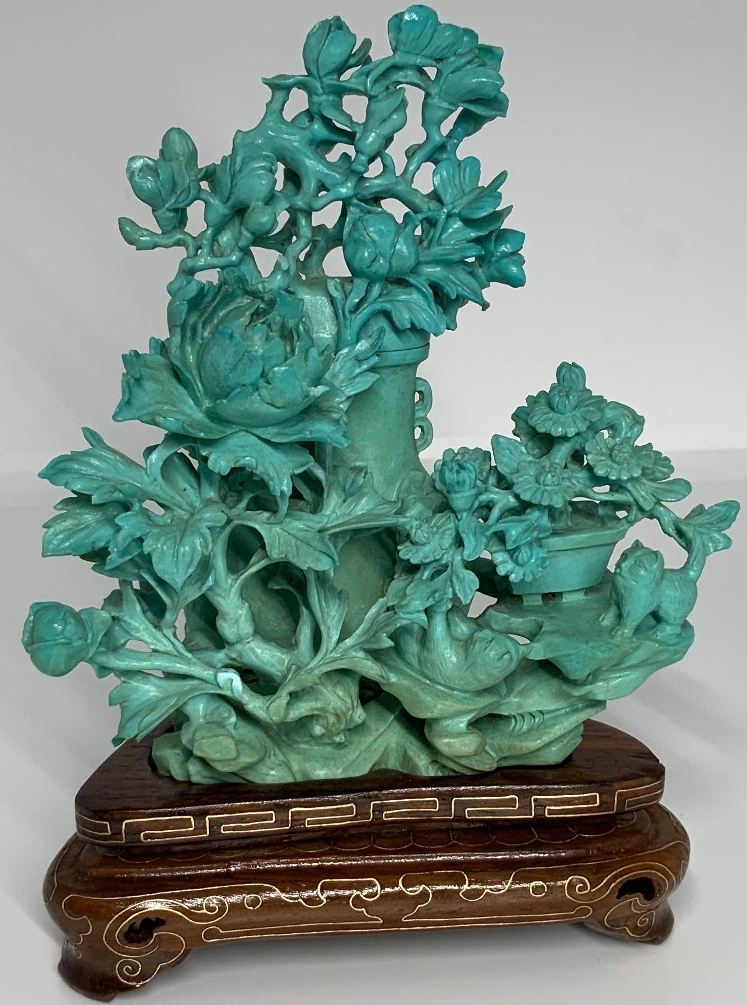 turquoise vase with flowers