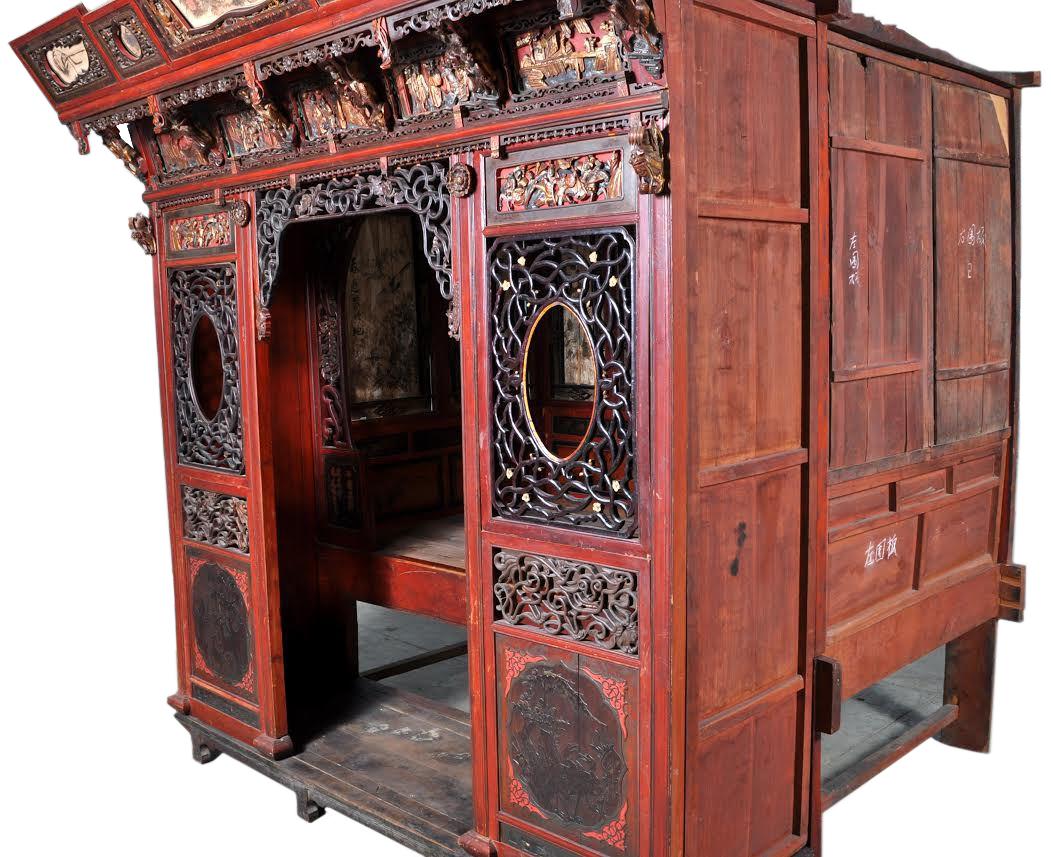 Chinese carved wedding bed, Qing Dynasty, circa 1880. The bed is finely carved, poly-chromed, and lacquered, most likely Cantonese. The cornice having reticulated and hand painted panels, below are deeply carved panels with scenes representing