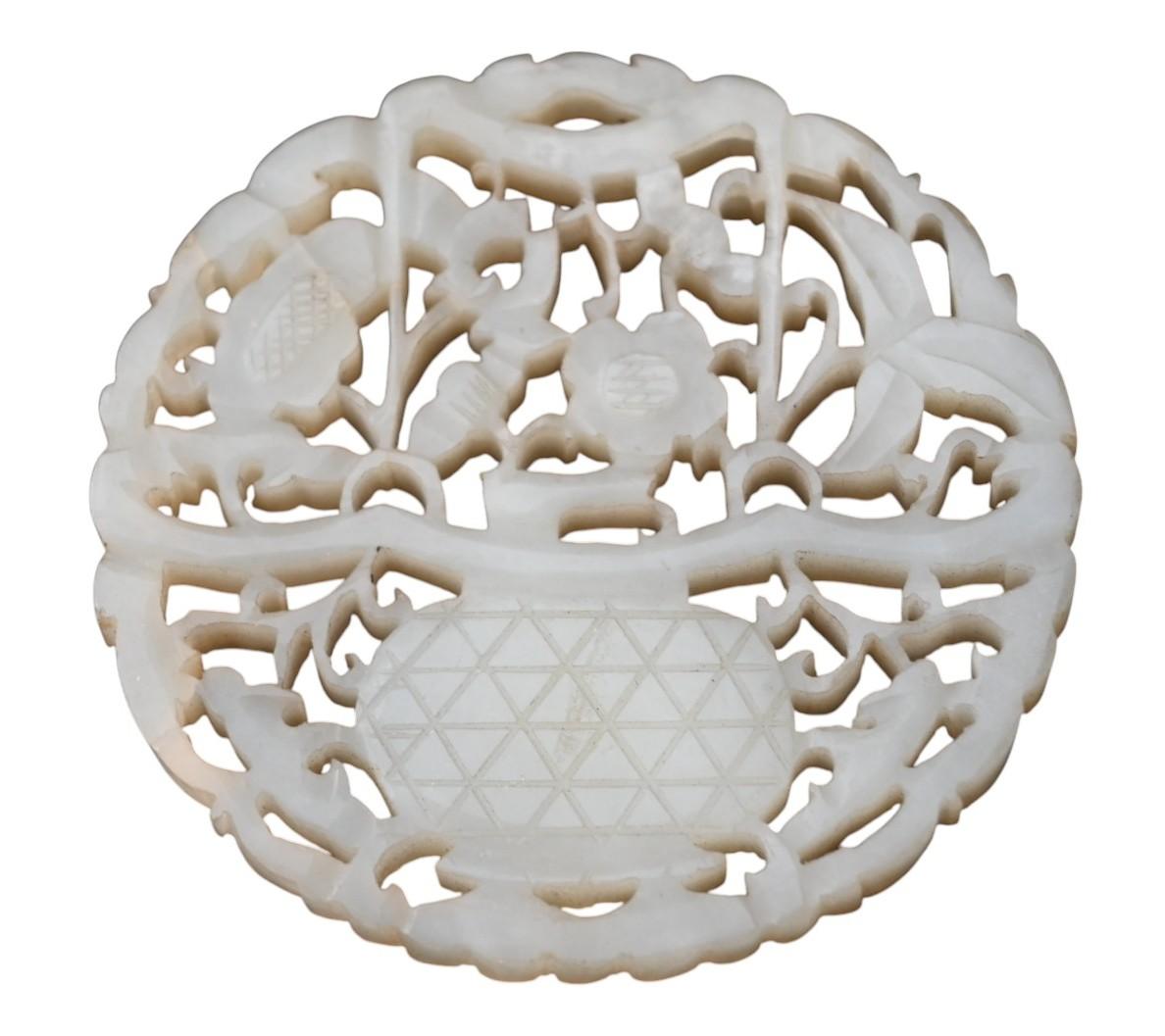19th Century Chinese Carved white jade disc with openwork decoration on a wooden base, Qing For Sale