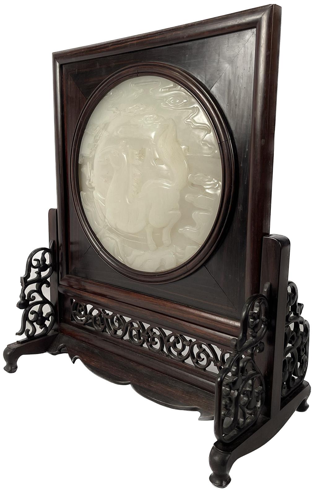 An early 20th century Chinese carved white jade table screen with a horse and clouds. 

Dimensions: 18.25