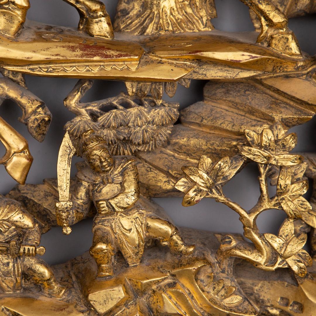 Relief made of carved and gilded wood, with applications in different materials. 
Some chip and repairs. Differences in shade. Wear due to age and use.