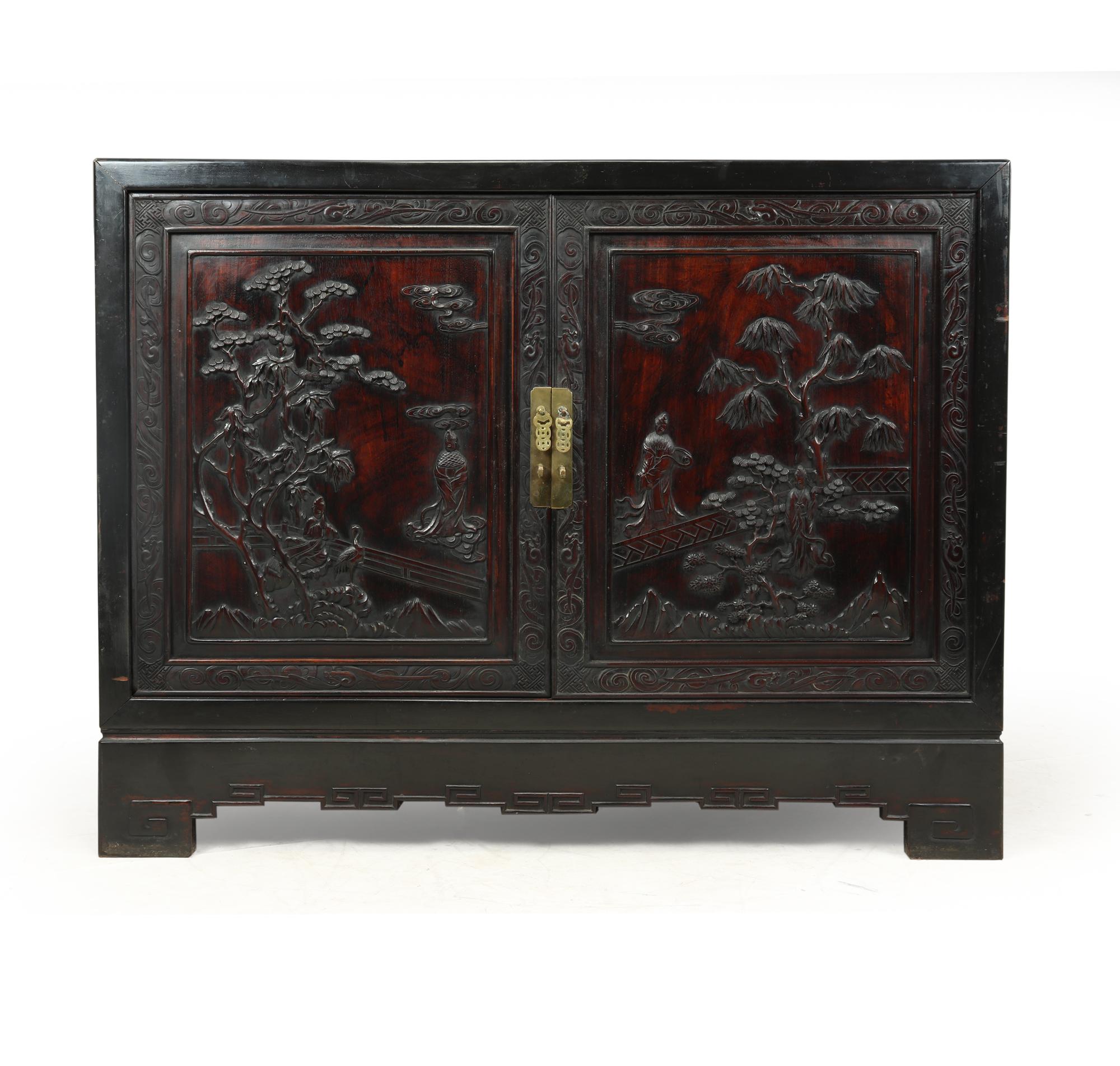 A two door sideboard fitted with drawers inside produced in China in the 1920’ from Zitan and crisply carved and then black lacquered, I am unsure of the timber but the cabinet is very heavy almost like it is padouk, the carved panels are excelent