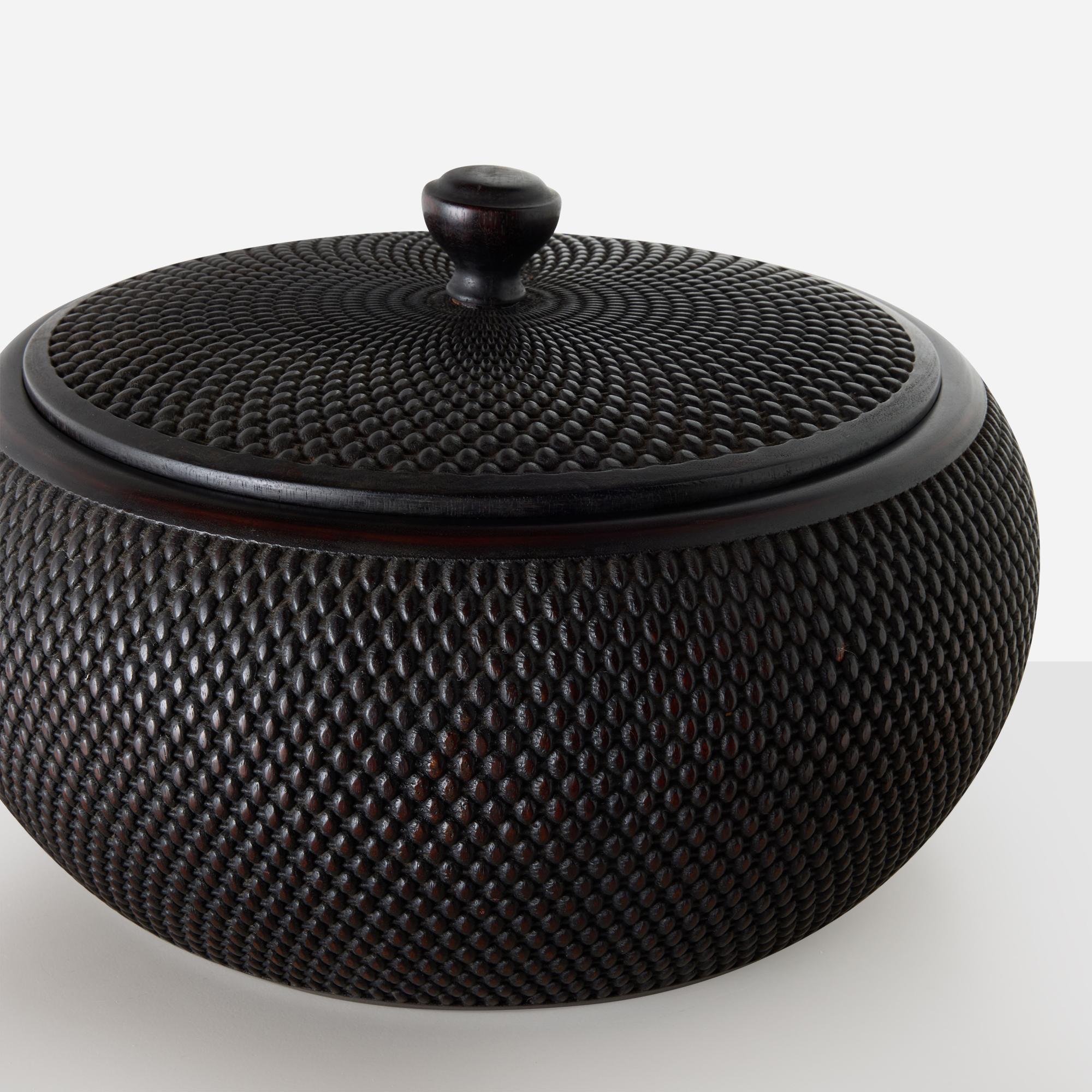 Chinese Carved Zitan Wood Lidded Container

Round lidded container carved from zitan wood, featuring an intricate pattern that mimics woven bamboo.

Additional information:
Dimensions: Height: 6.5″, Diameter: 12″