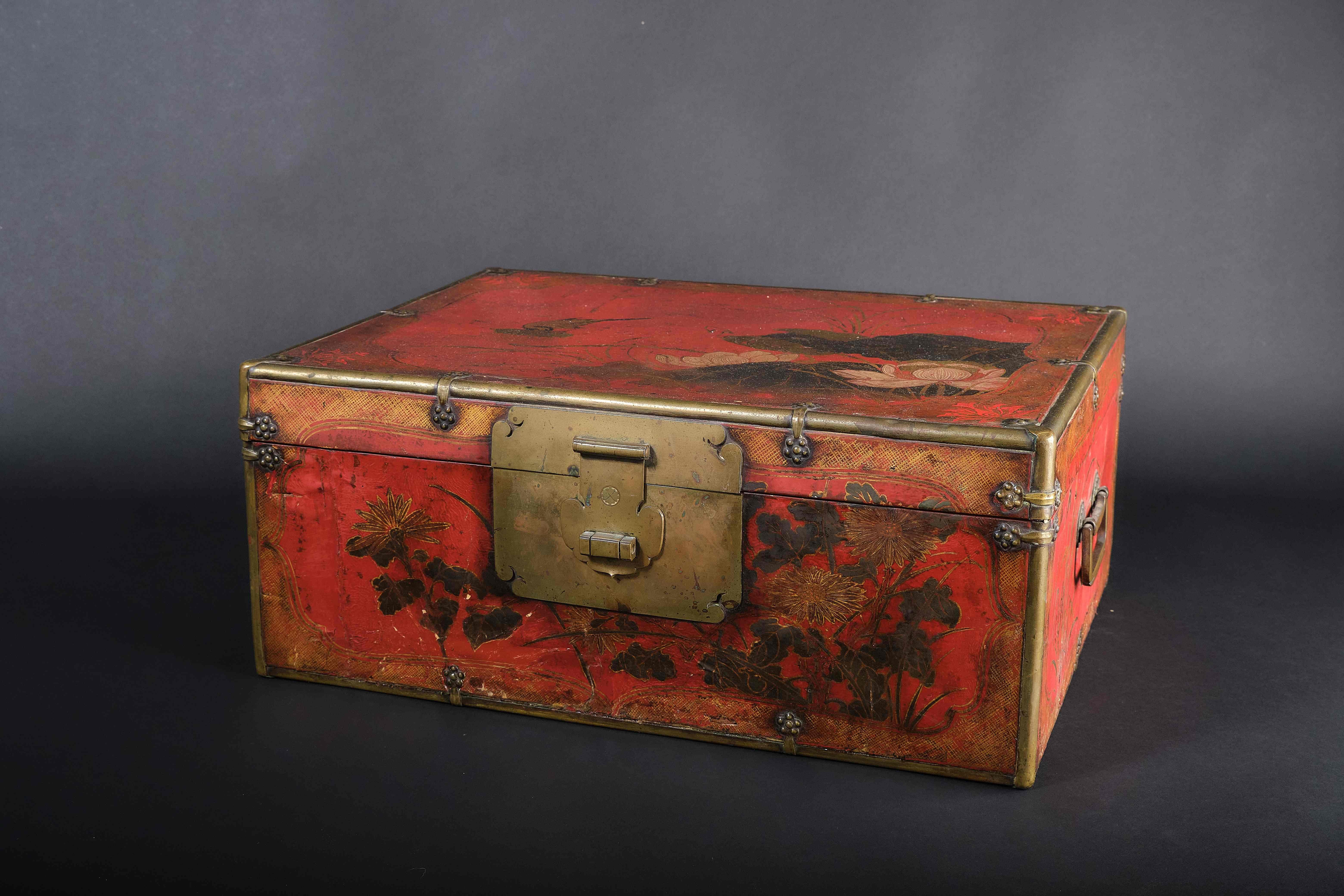 Unusual Chinese cassette with brass fittings and a red painted parchment cover. Stylized floral decoration on all sides, partly with gold hatched frame borders. Characteristic brass mounts and large box lock with folding latch. China 18th HD photos