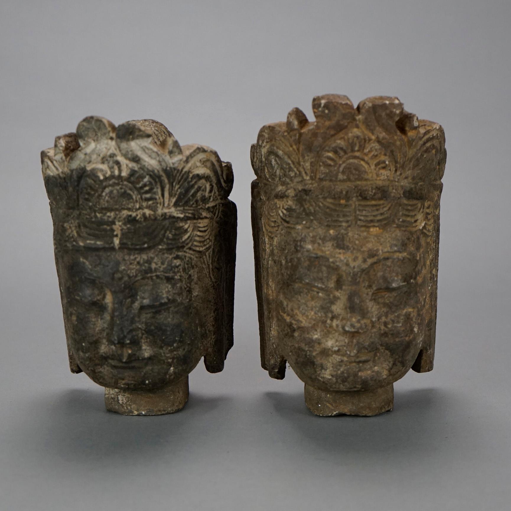 A pair of Chinese Buddha head busts offer cast stone construction, 20th C.

Measures- 8''H x 4.75''W x 4.5''D