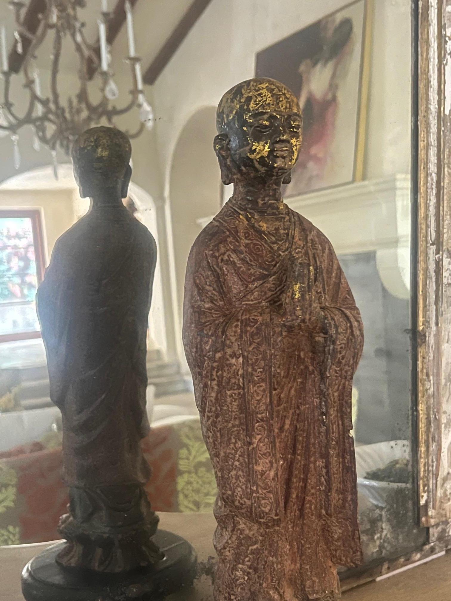 Cast iron Buddhist monk, cast around 1880, likely in Guangdong, China. The monk has original paint and some some remaining gilt.

The monk stands snugly on a hand made mid 20th century base to add stability to the statue.

Statue without base 17.75