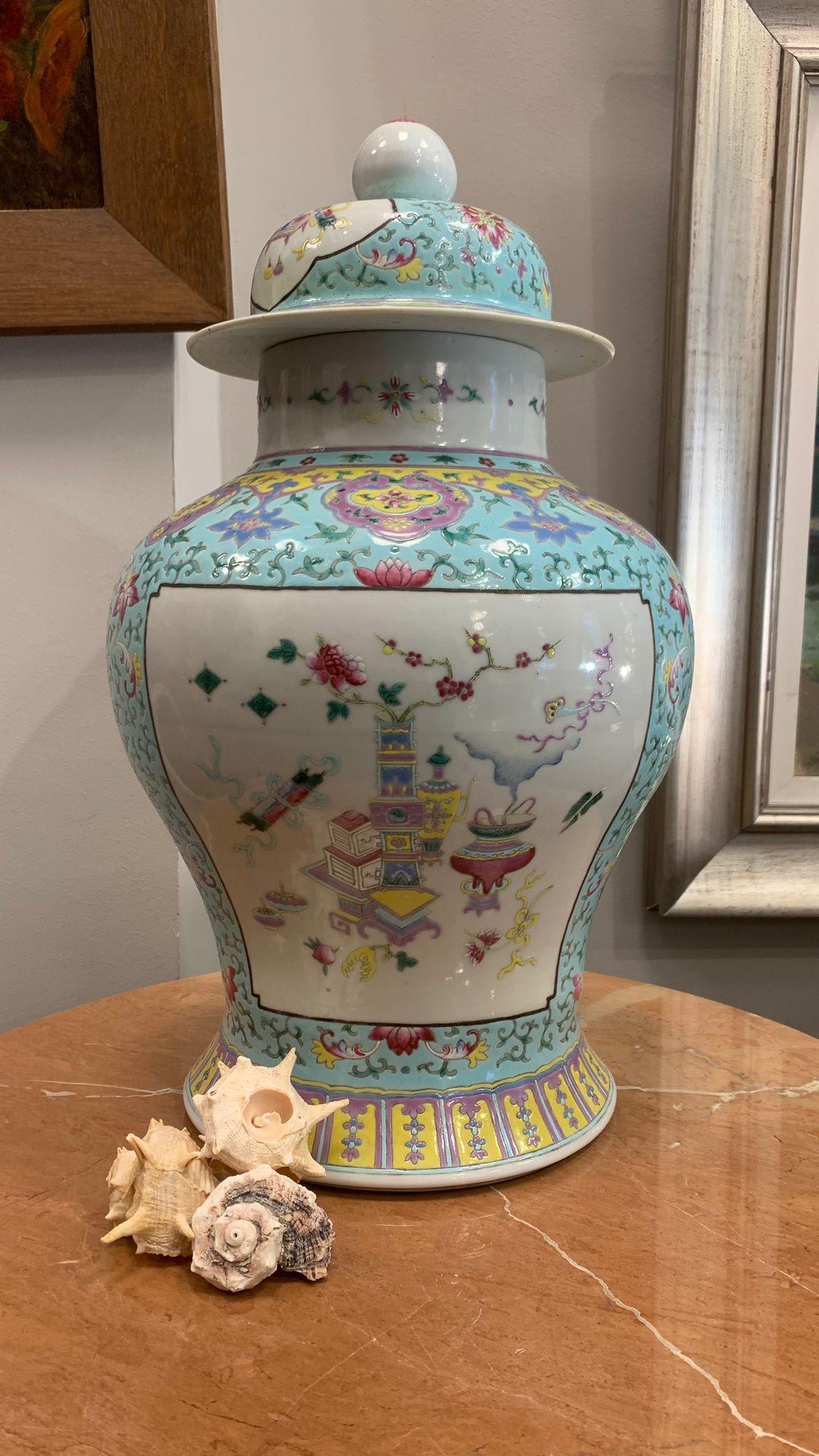 Important covered Chinese Porcelain vase with flat seat.Hand-painted.Circa 1930
The domed body is decorated with fruits, branches, flowers and butterflies in pastel colors on a celadon  color background.
The small lid is decorated with the same