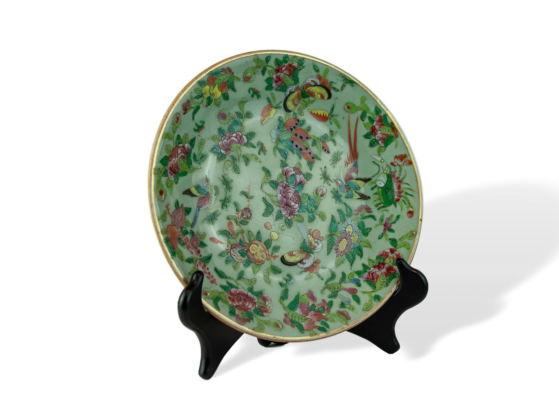 Chinese celadon Famille rose 9.75 inch plate, Canton, circa 1820, enameled with stylized pheasants, floral and fruit sprays, and carrots (rare), reserved on a celadon ground. Underglaze-blue seal mark.