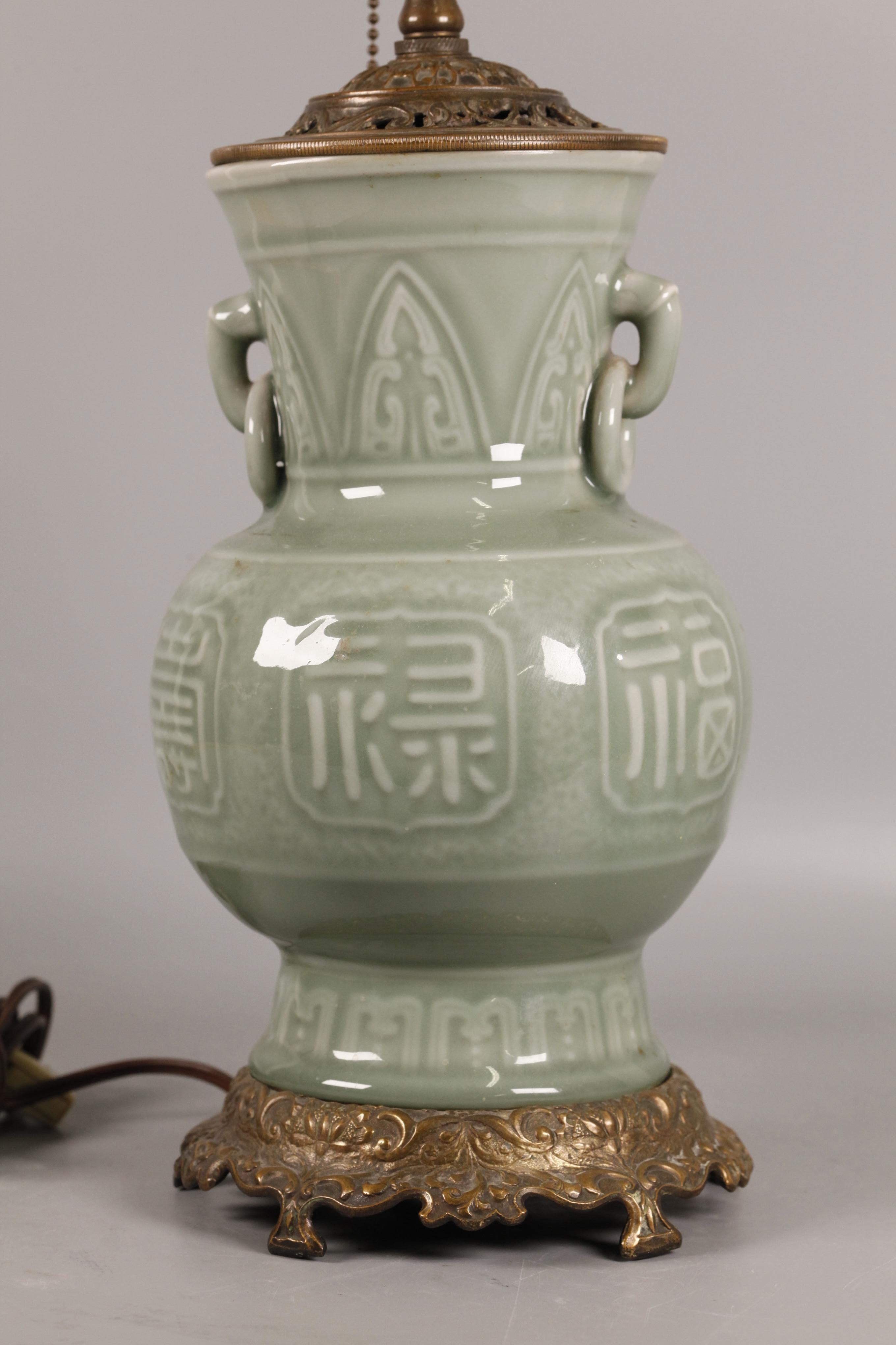 10.5in(H) is the height of the vase and the bronze base only (it does not include the bronze cover and the lighting components above the cover) 
