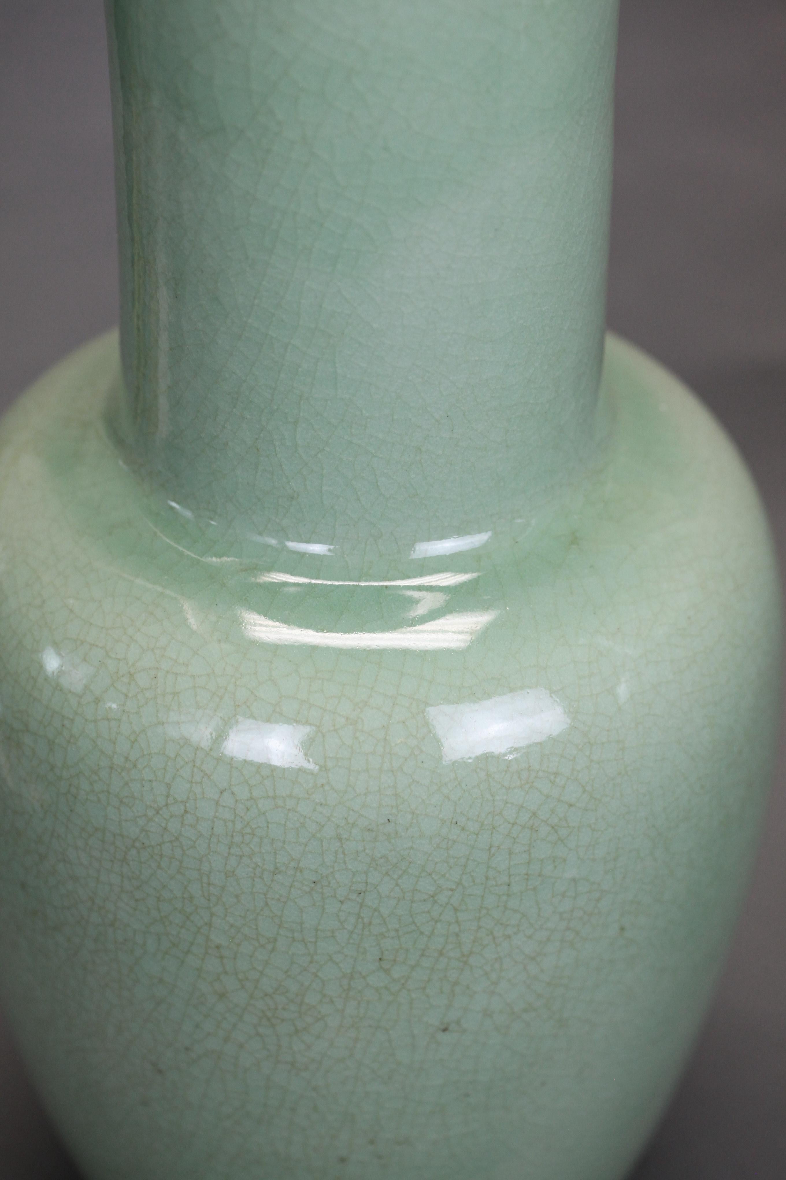 metal bases shown in pictures are included with these items; celadon glazed, crackle decorated vases; each porcelain vase on fitted bronze base; approximate measurements of each vase only: 8in(diameter) x 16in(H); approximate measurements of vase