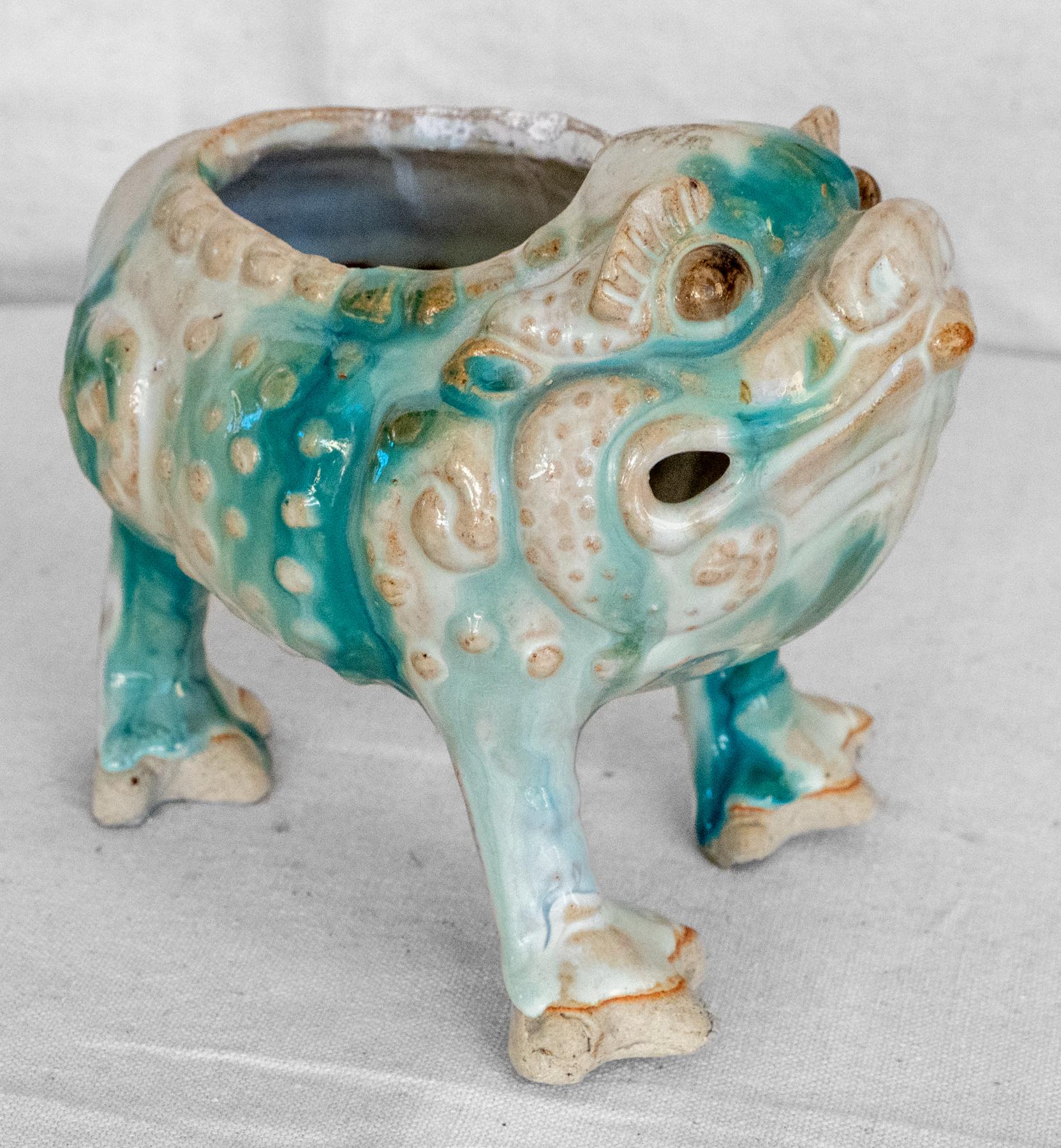 Chinese ceramic 3 leg cash toad, circa 1900. Low fired clay with beautifully applied drip glaze in greens and white. In the style of a Ming Period Censor. 
May also be used as a small bulb bowl. Great decorative presence. The three legged toad /