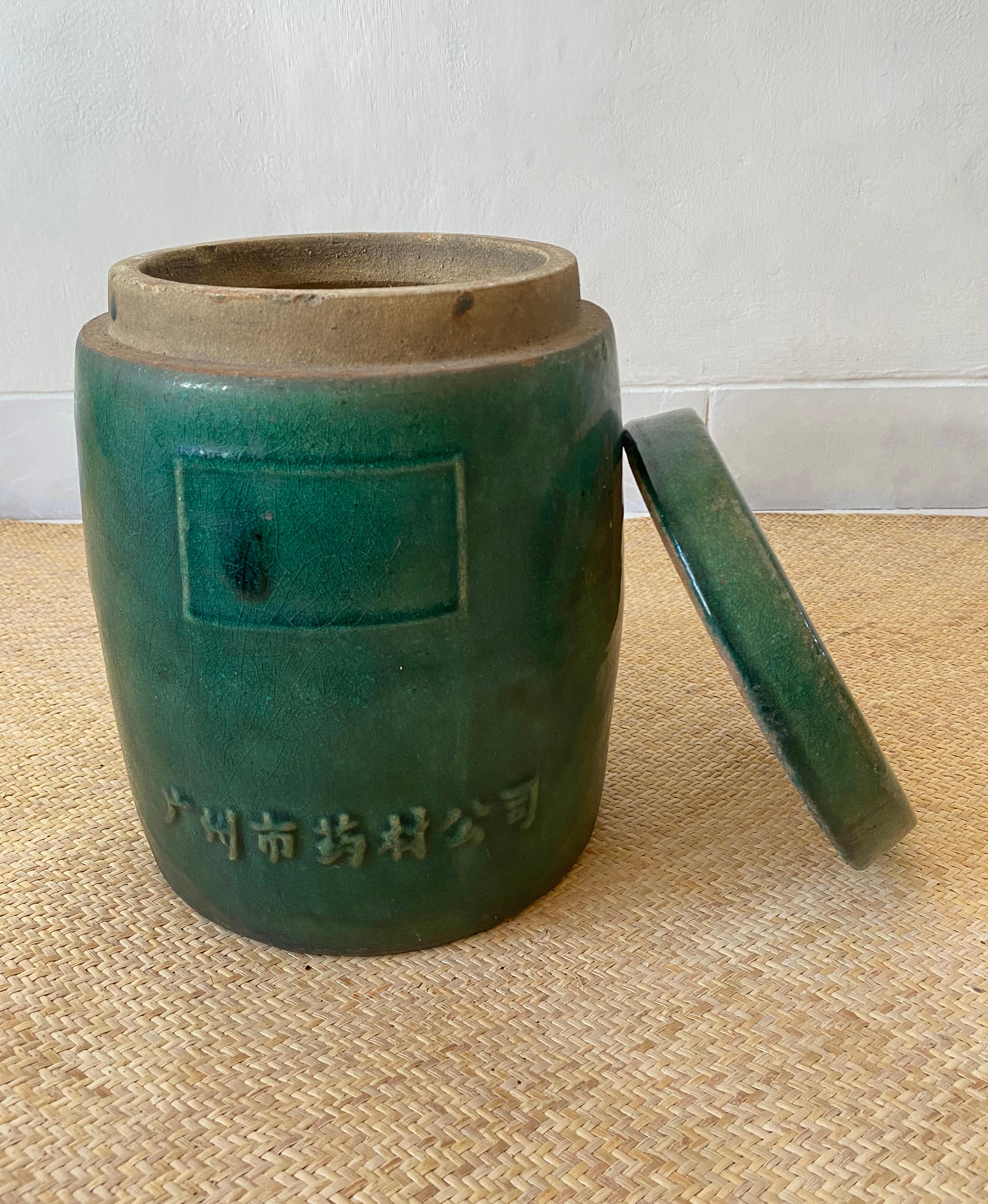 At the turn of the 20th century Chinese medicine businesses were highly successful enterprises, the vast majority of these operating out of Guangzhou. This lidded container was used to transport medicinal herbs and spices. The flat lid and barrel