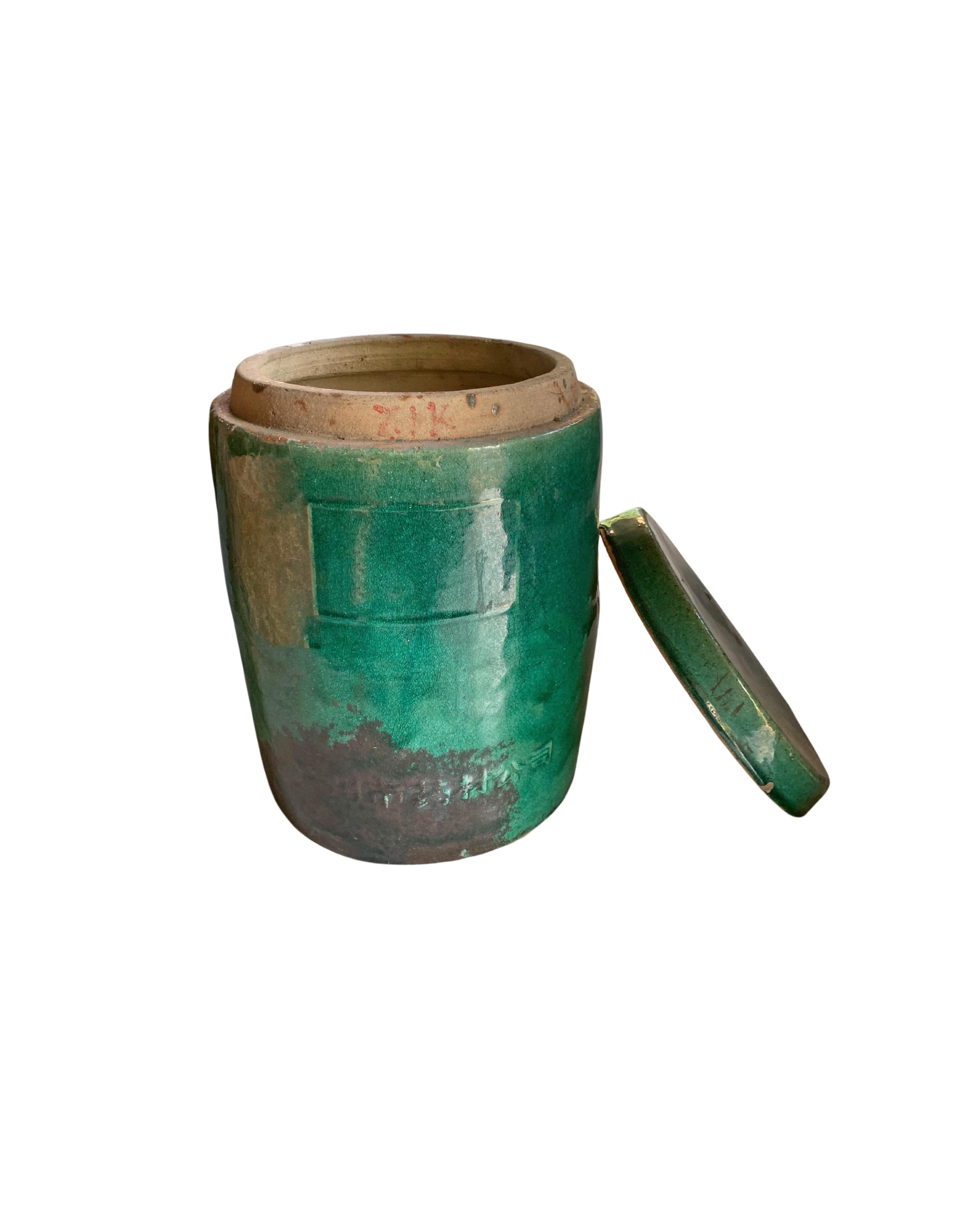 At the turn of the 20th Century Chinese medicine businesses were highly successful enterprises, the vast majority of these operating out of Guangzhou. This lidded container was used to transport medicinal herbs and spices. The flat lid and barrel