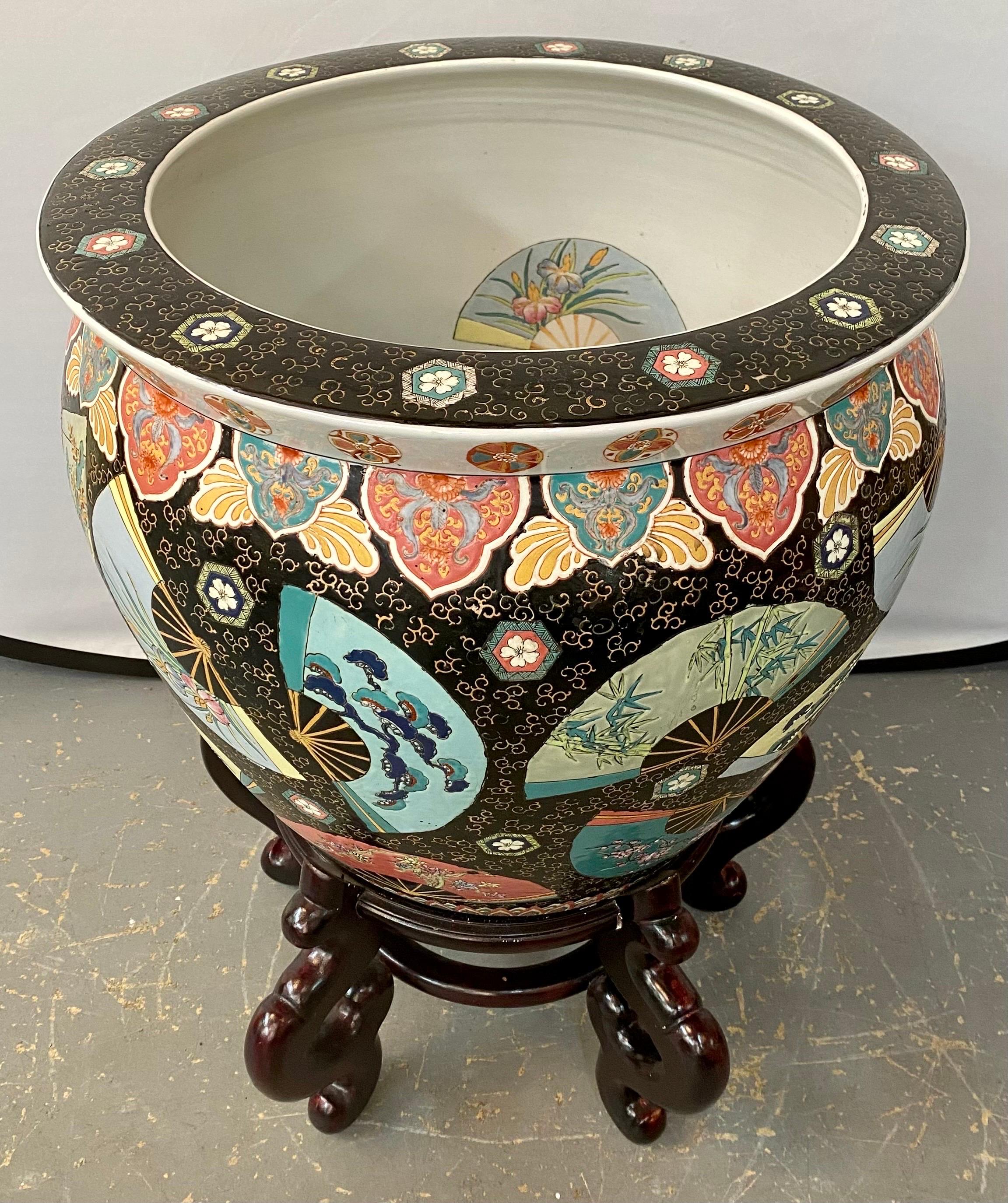 
Elevate the ambiance of your indoor or outdoor living space with a touch of Oriental charm courtesy of the Chinese Ceramic large fishbowl jardiniere or planter. This exquisite piece of craftsmanship seamlessly marries artistry with functionality,