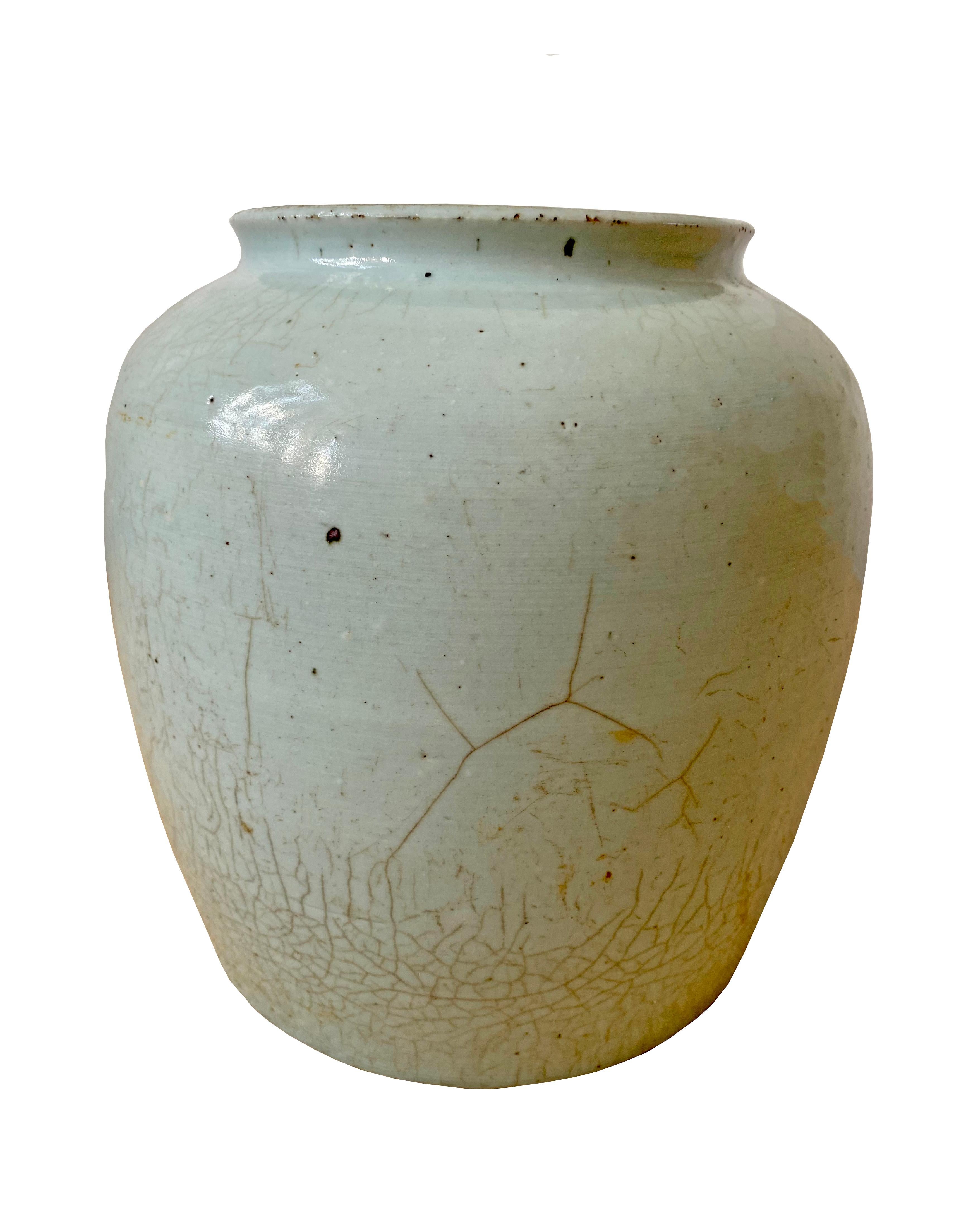 This pot is a Longquan celadon ceramic pot from Zhejian provence in south China. It has a beautiful cracked glaze and light green hue.

Dimensions Height 27.5cm x width 26cm.