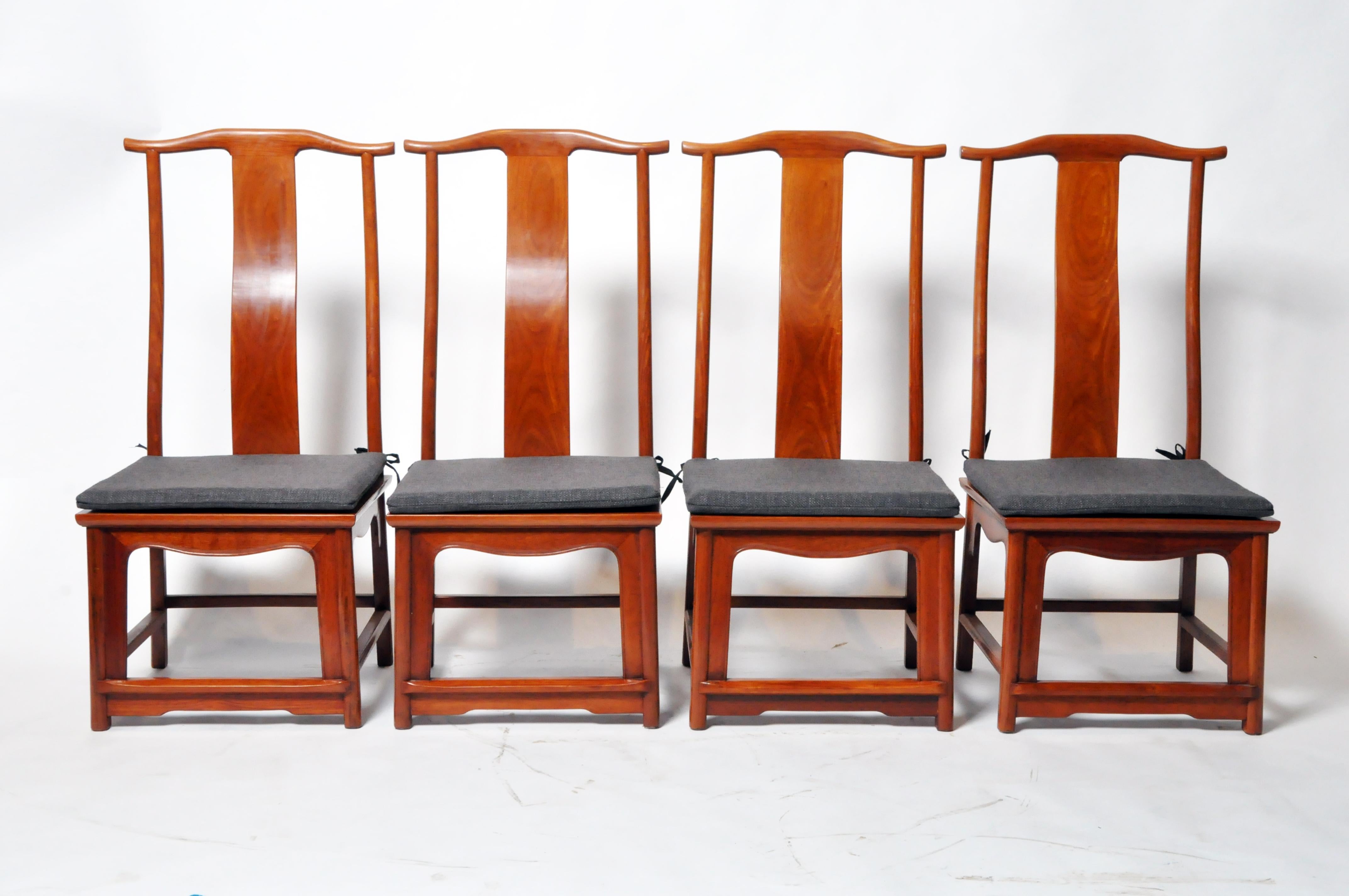These contemporary Chinese chairs feature hardwood construction and elegant, traditional curved back splats for maximum comfort. The chairs are finished in a modern clear lacquer. They are somewhat lower than typical to allow for the addition of