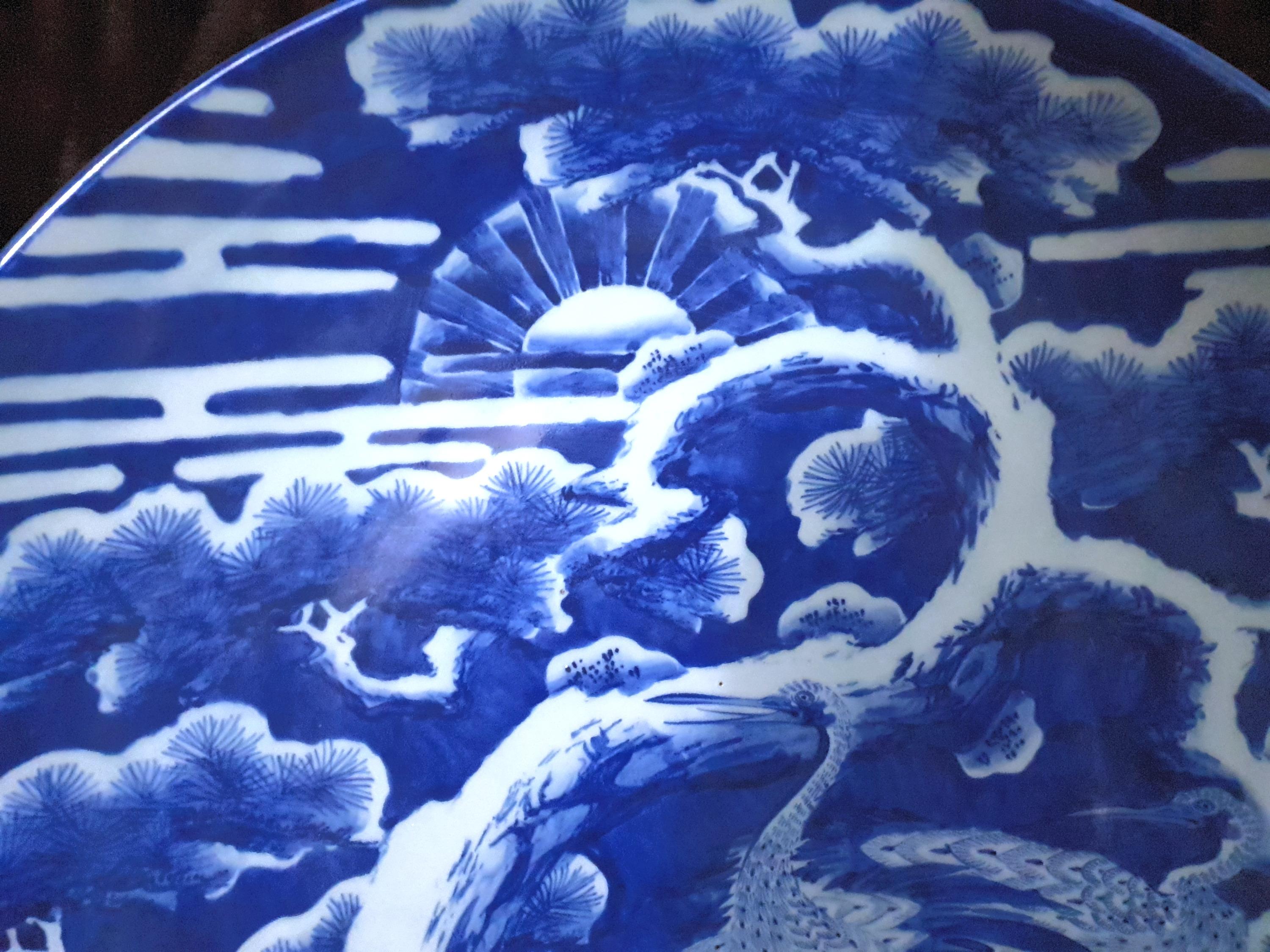 An rare and large Japanese Meiji period charger dates from 19th century. Stunning deep blue scenes with the main focus on three birds or mythical creatures. This piece is very significant due to the deep color and the Size. Marks are accompanied on