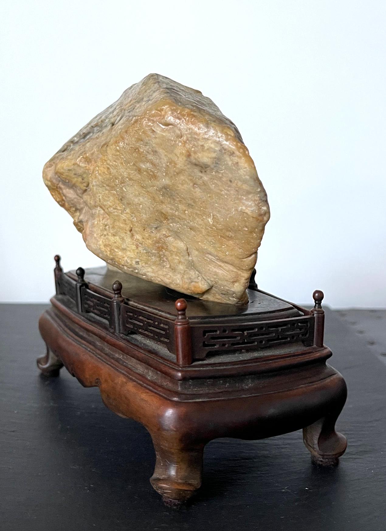 20th Century Chinese Chicken Blood Stone Carving of Bodhidharma on Wood Stand For Sale