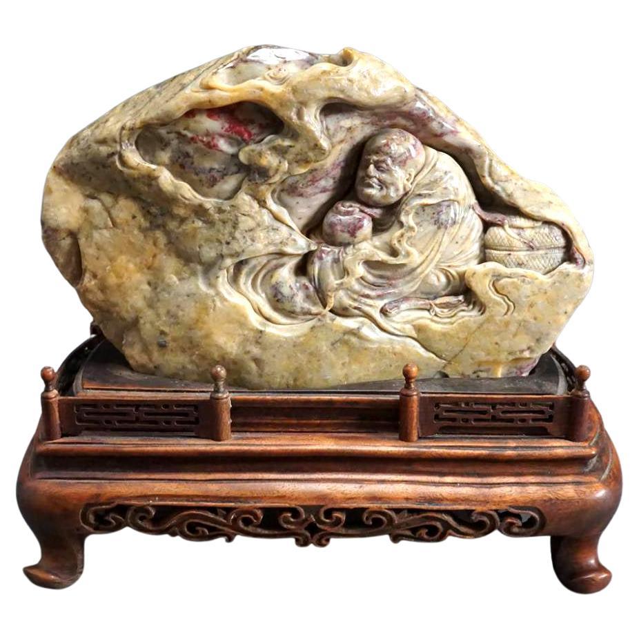 Chinese Chicken Blood Stone Carving of Bodhidharma on Wood Stand For Sale