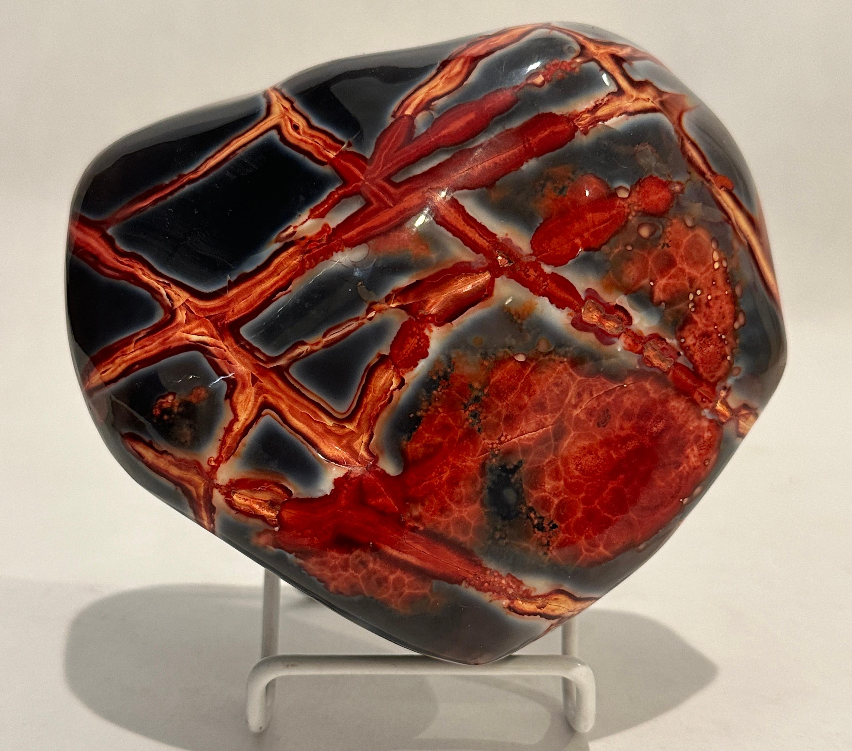Bright, deep rich red ground and veins on a deep grey background. Chunghua, China Chicken Blood Stones are a prized ornamental material made of quartz, cinnabar as well as other materials.