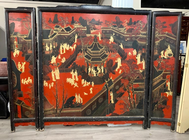 Like nothing else you've seen, this magnificent chinoiserie three piece antique coromandel screen has one large middle section that measures sixty inches wide and then two side sections that attach and each measure and additional fifteen inches