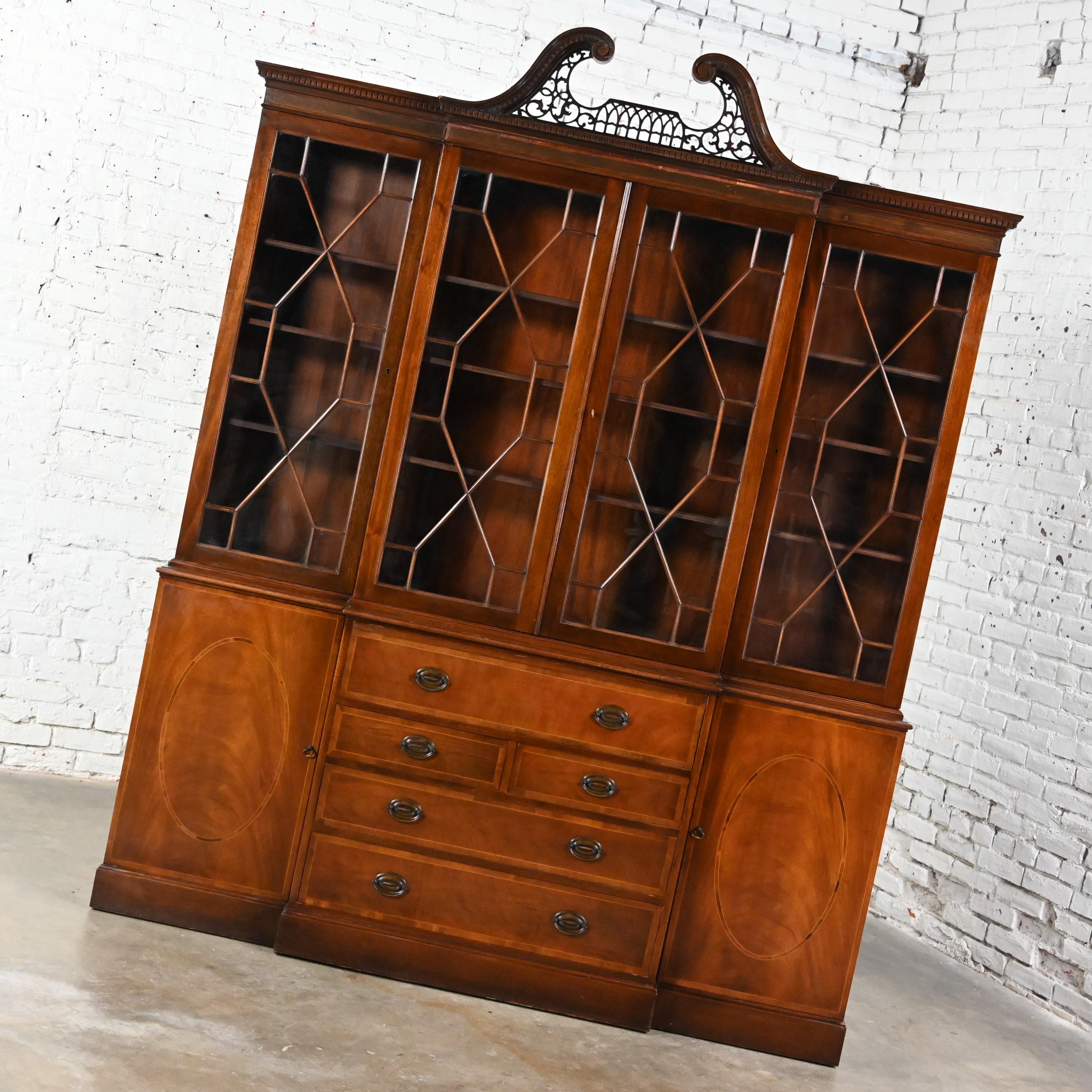 Marvelous Mid-20th Century Chinese Chippendale Baker Furniture mahogany & walnut breakfront secretary china cabinet or bookcase with pierced pediment top, glass door fronts with mullions & true divided lites, Hepplewhite brass shield & bale pulls, &