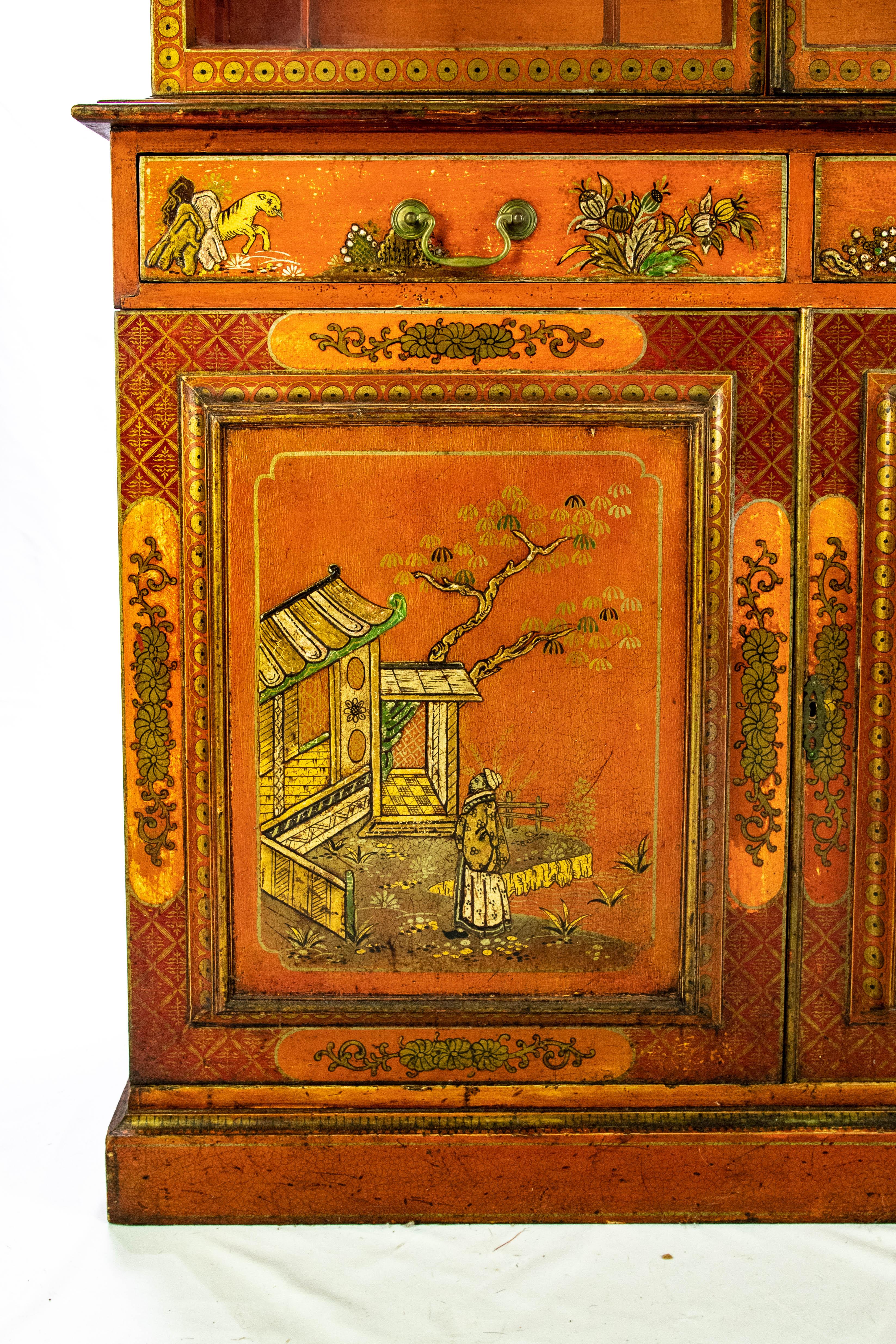 For you consideration is the magnificent Chinese red chinoiserie Chippendale cupboard. Starting on the bottom it sits on a very geometric square base that rises to a set of double doors and double drawers. Each door depicts a different scene and the