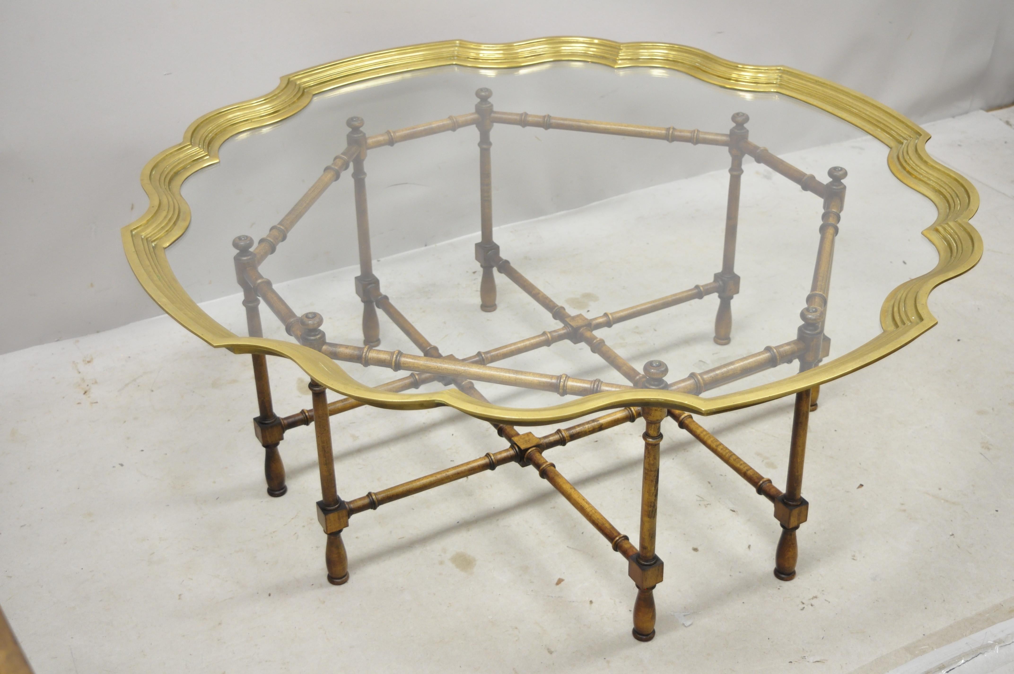Vintage Chinese Chippendale faux bamboo scalloped edge brass tray top coffee table. Item features a wooden faux bamboo base, glass tray top with brass scalloped edge, very nice vintage item, great style and form, circa mid-20th century.