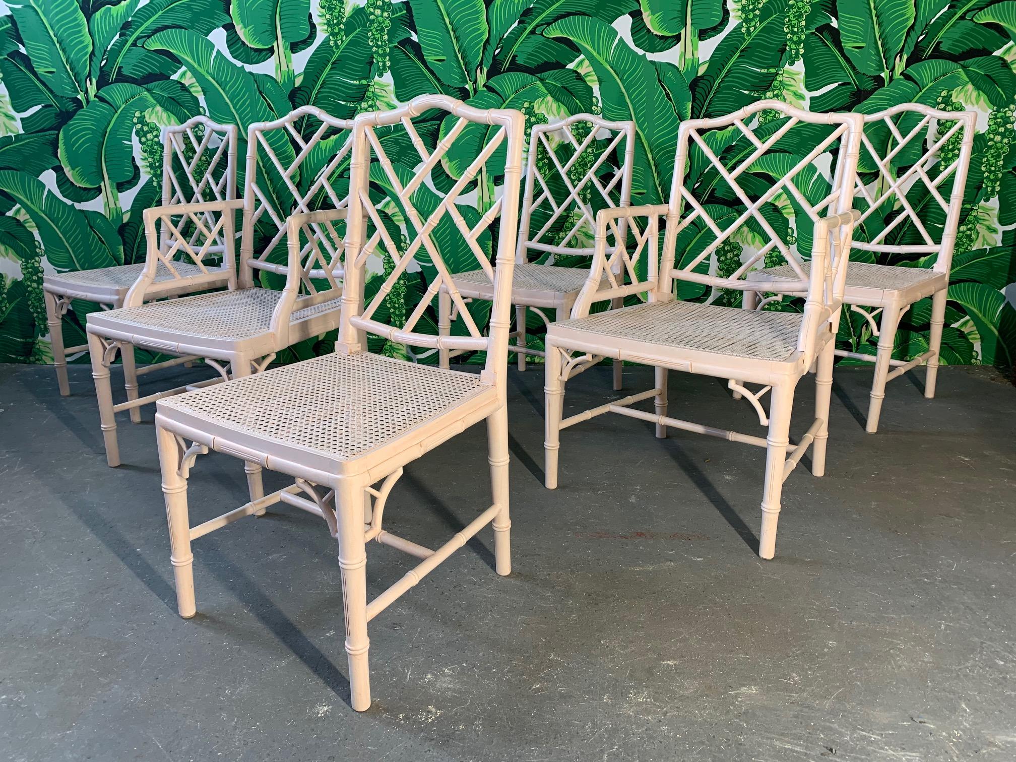 Set of 6 chinoiserie style faux bamboo dining chairs with cane seats in the Asian Chippendale style. Finished in a blush pink satin paint. Very good vintage condition with minor imperfections consistent with age. Chairs are structurally sound.