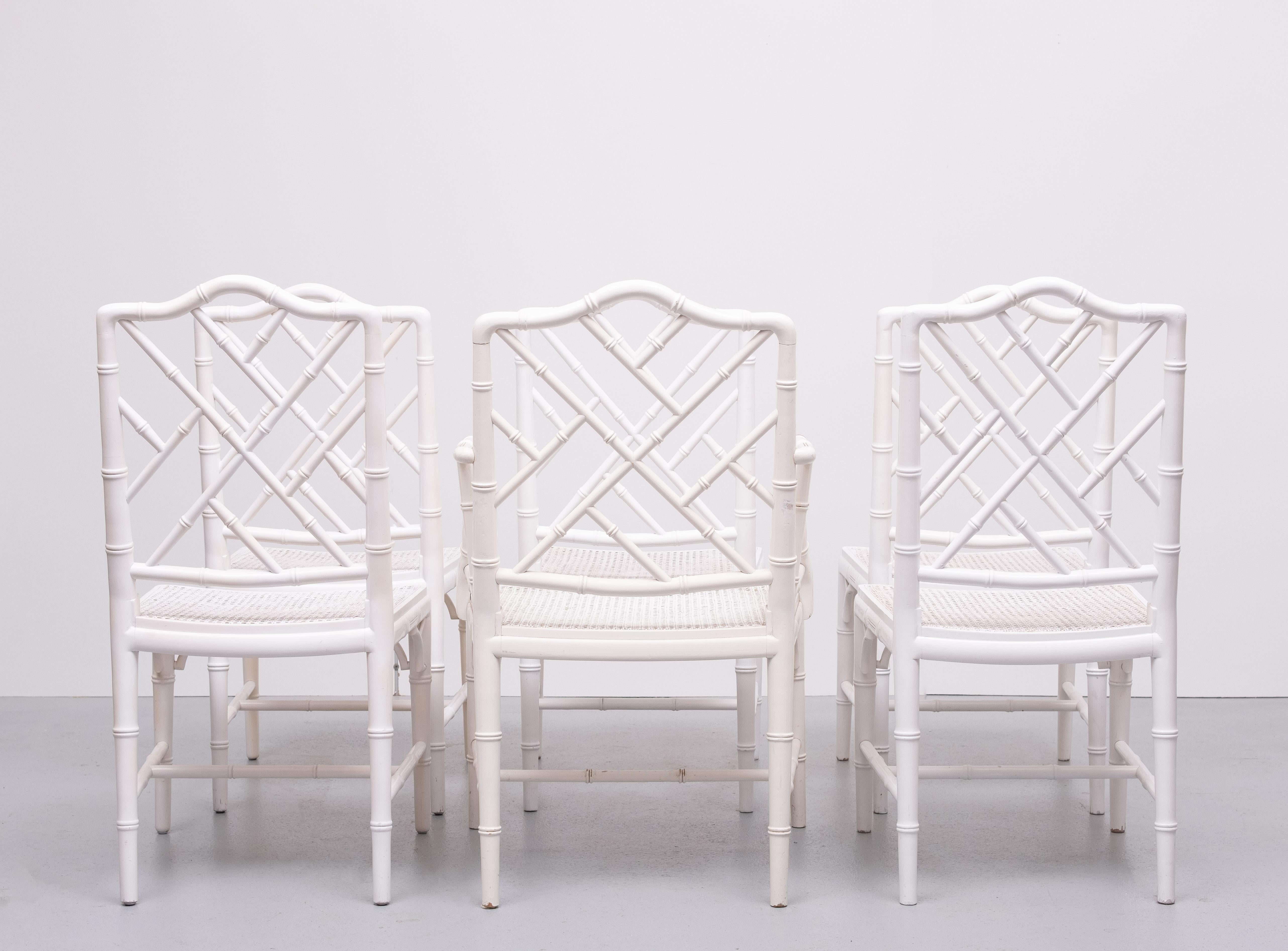 Add a touch of exotic elegance to your dining space with these Vintage faux  Bamboo Chinese Chippendale Dining Chairs. these chairs feature the classic Chinese Chippendale lattice design, combining intricate detailing with a refined, bohemian flair.