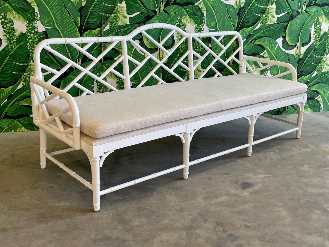 Faux bamboo garden sofa features chinoiserie style fretwork and solid tan cushions. Very good condition with only very minor imperfections consistent with age. We also have this sofa listed as a pair, check our other listings.

 