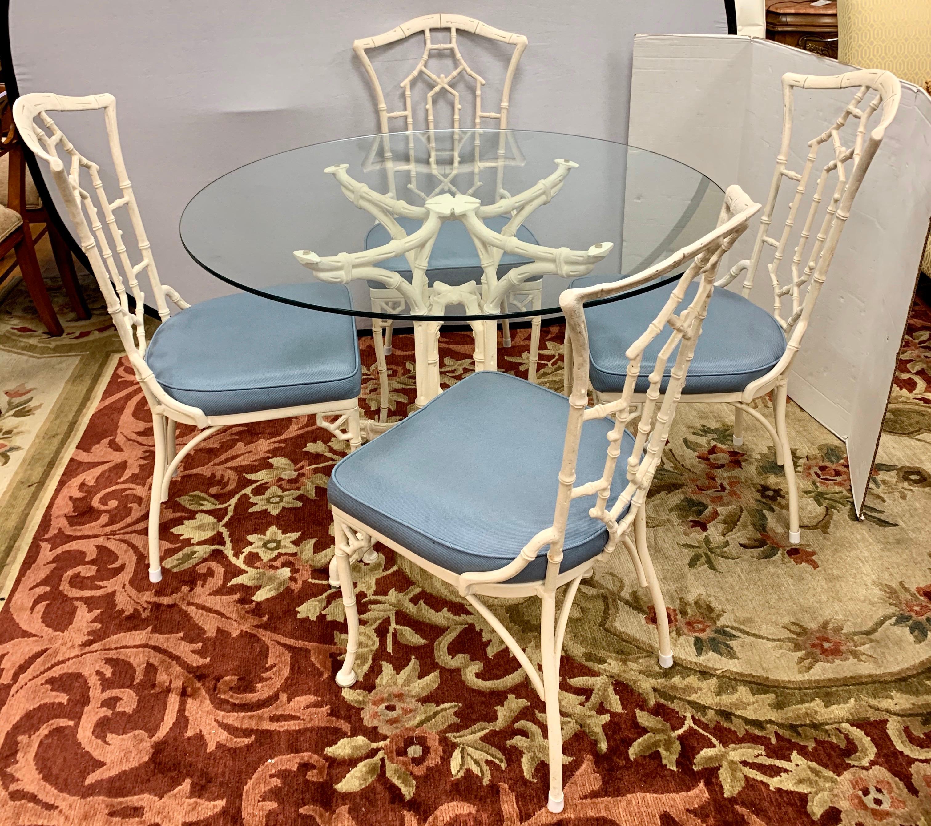 Magnificent Mid-Century Modern 5 pc. Chinese Chippendale cast aluminum and glass dining or dinette
set with a table and four matching chairs. The chairs have the coveted pagoda carving in the backrest and the upholstered seat cushions are tiffany