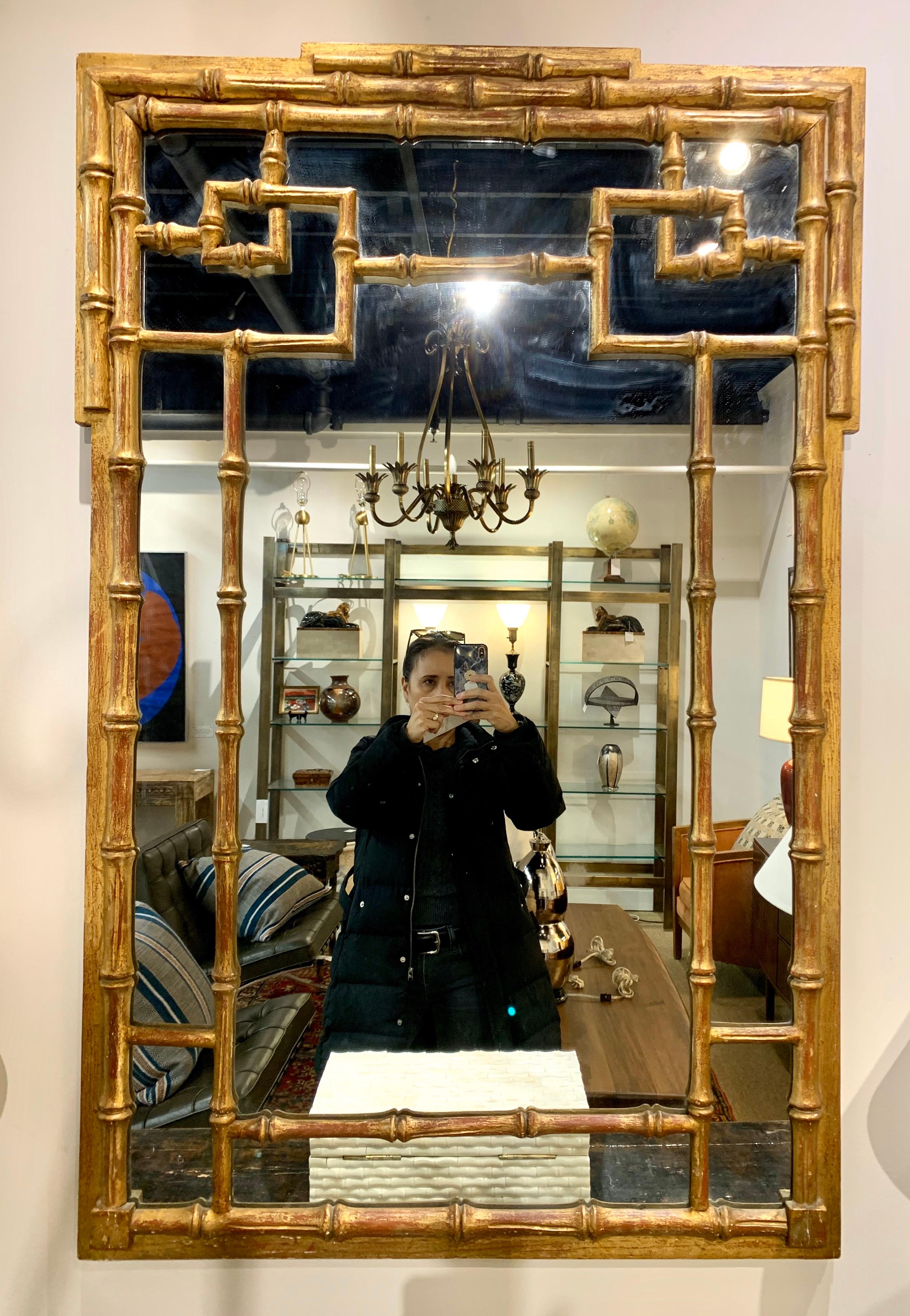Iconic Chinese Chippendale large wall mirror painted in gold. Guaranteed to take your home to another level of midcentury awesomeness!