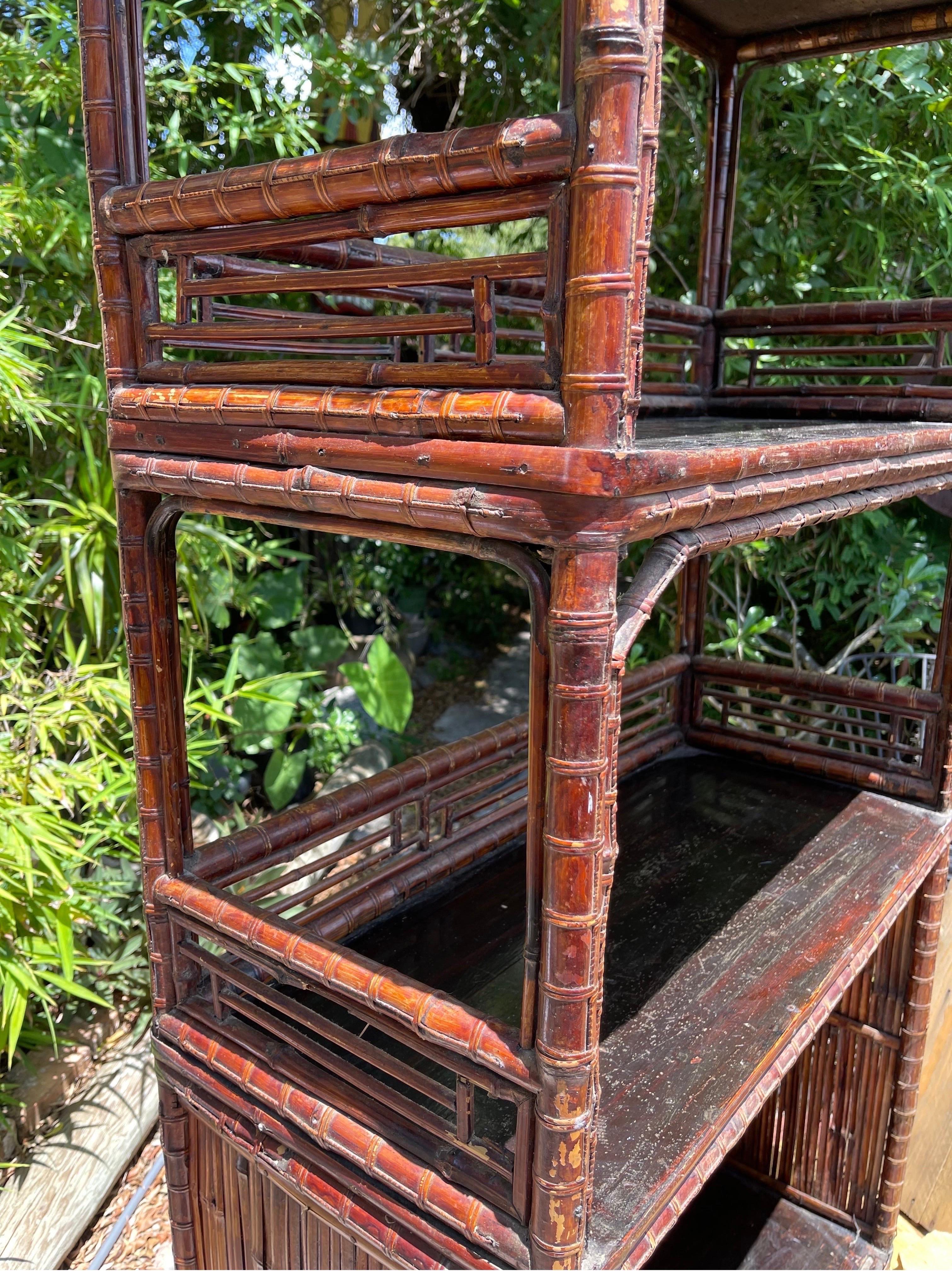 Fabulous, all-original mid-20th century bamboo etagere in a classic Chinese Chippendale style.