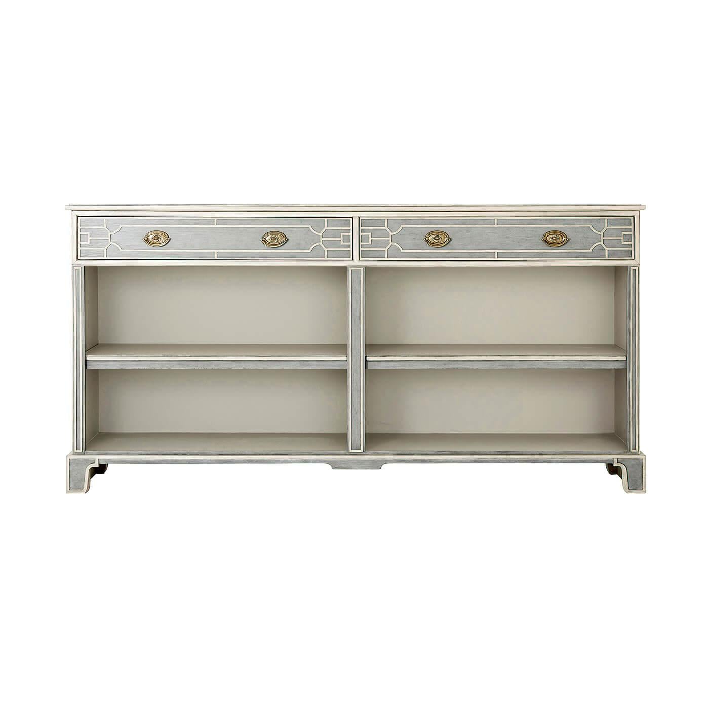 A Chinese Chippendale style painted open bookcase with two blind fret-carved frieze drawers having brass handle pulls and two open shelf sections raised on bracket feet.

Dimensions: 72