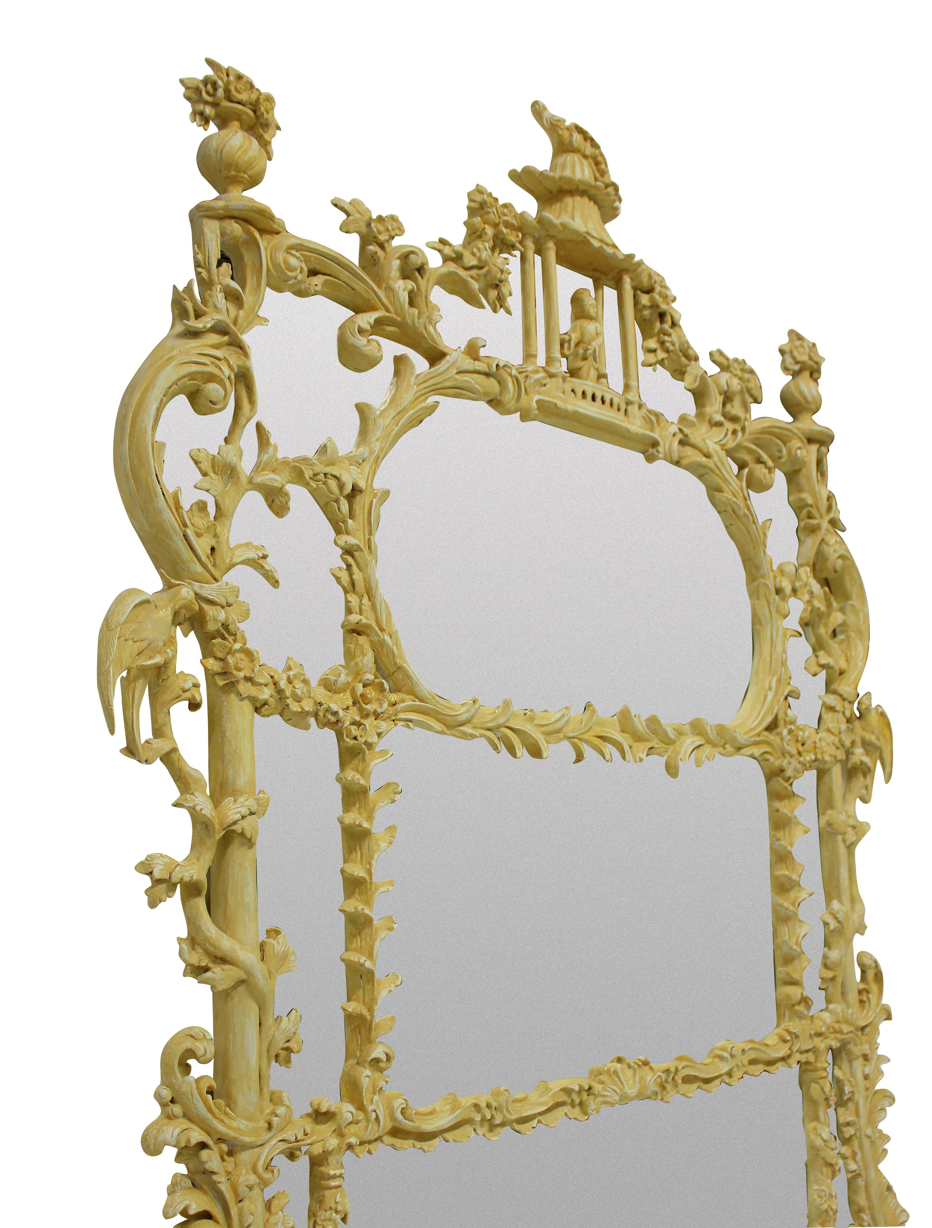 A beautifully carved Chinese Chippendale revival overmantel mirror in ochre bole. Depicting foliage, ho birds and flowers with a central pagoda and figure at the top.