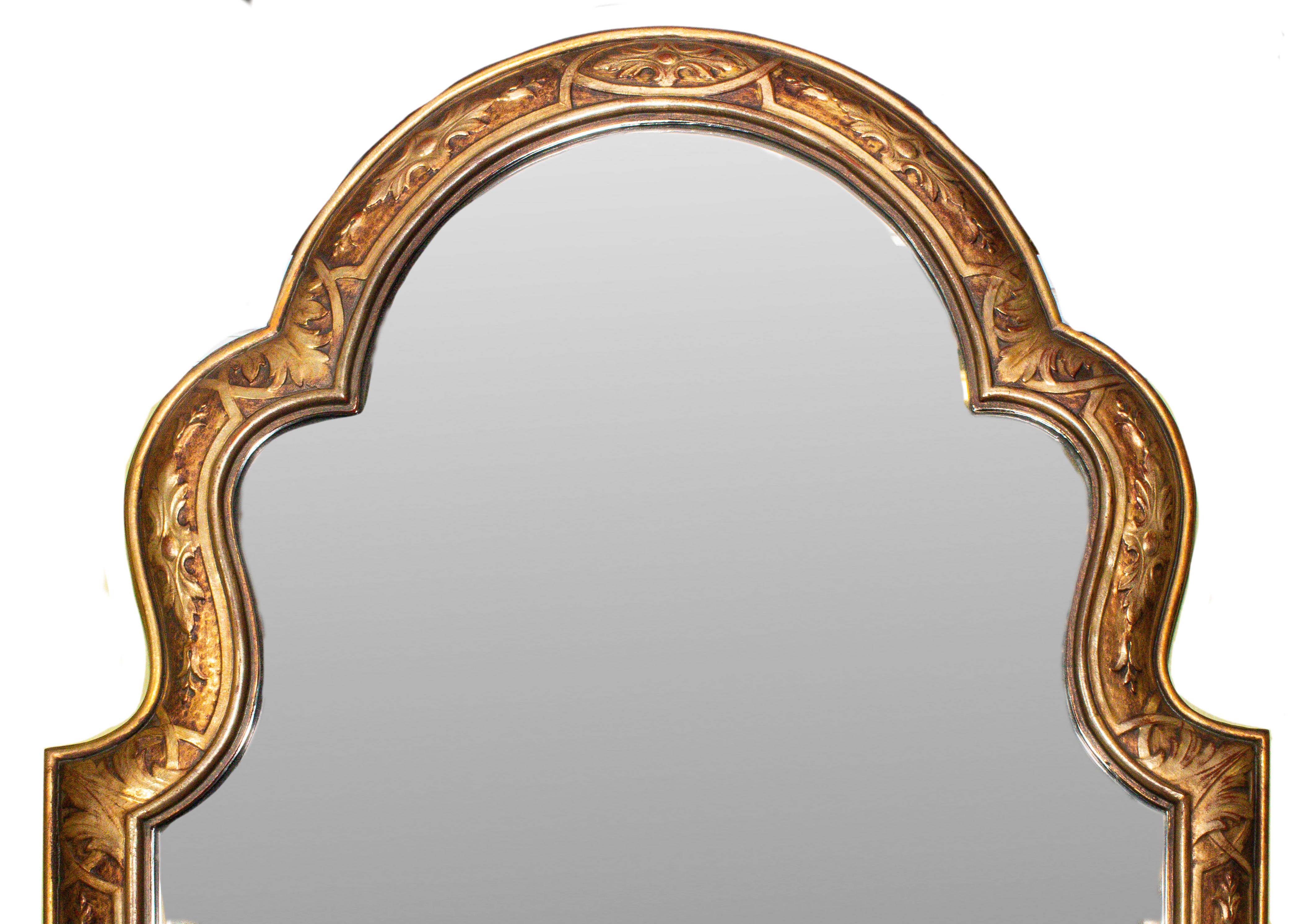 Hand carved shaped Chinese Chippendale style wood mirror with gold and silver finish. Made in Italy in the 1970s.