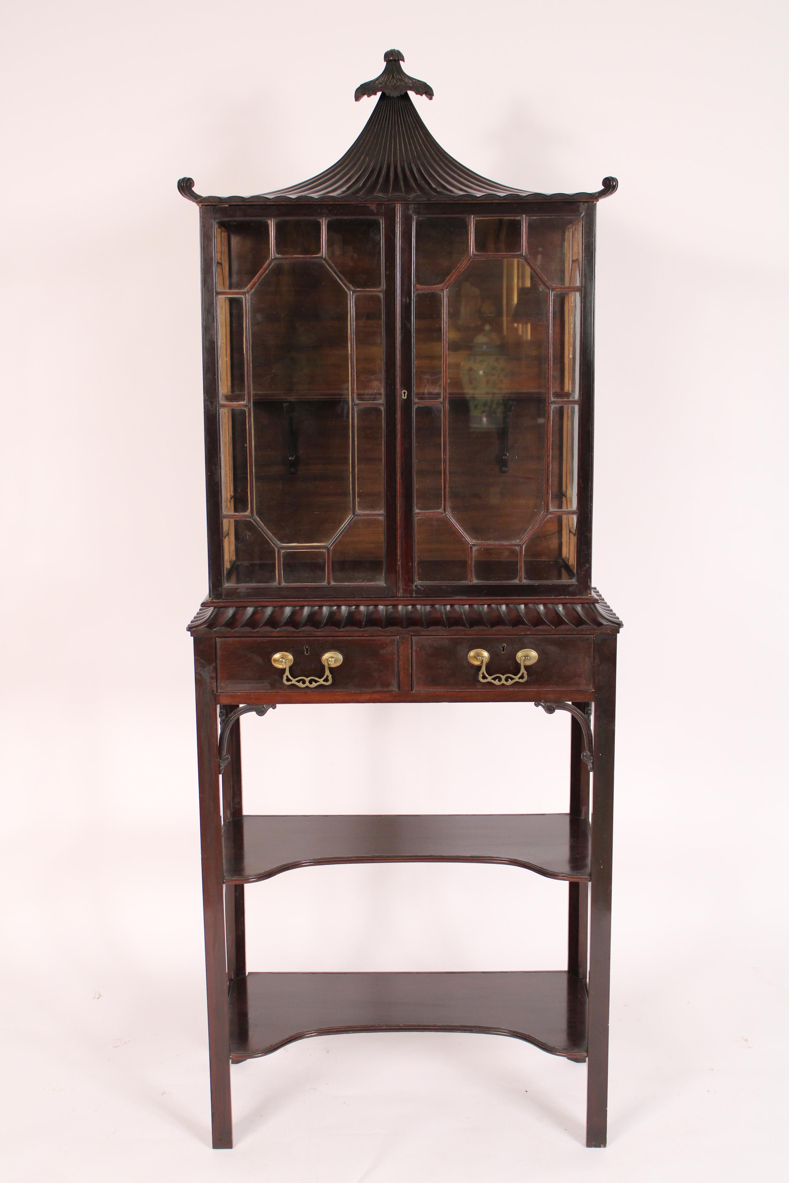 Chinese Chippendale style mahogany display / vitrine cabinet, circa 1900. Made in the Edwardian period. Excellent workmanship throughout, through mullion glass doors, finely dovetailed drawer construction, the back is attached with screws not