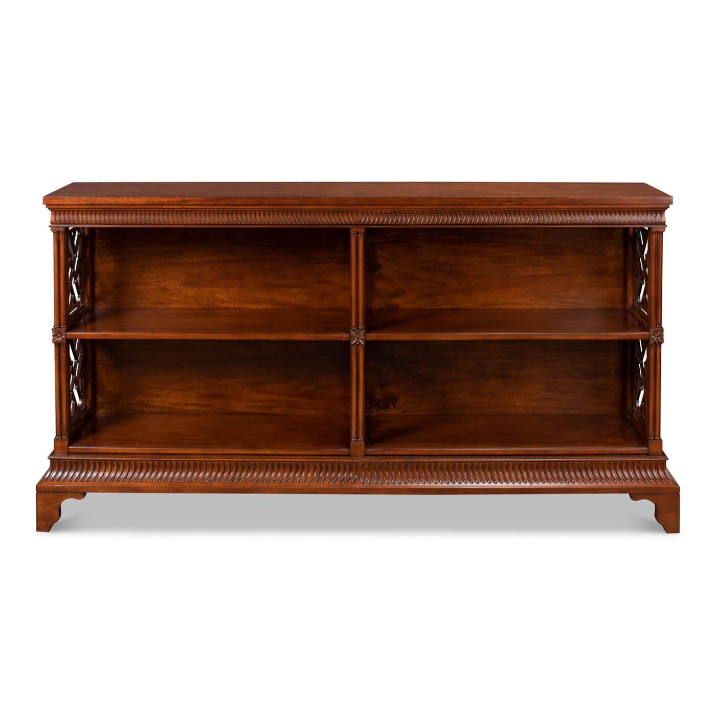 Chinese Chippendale style open bookcase with a walnut finish and with open fretwork trellis sides. A stately piece perfect for book storage and display. Inspired by popular 18th-century English designs, this piece reminds you of the elegant
