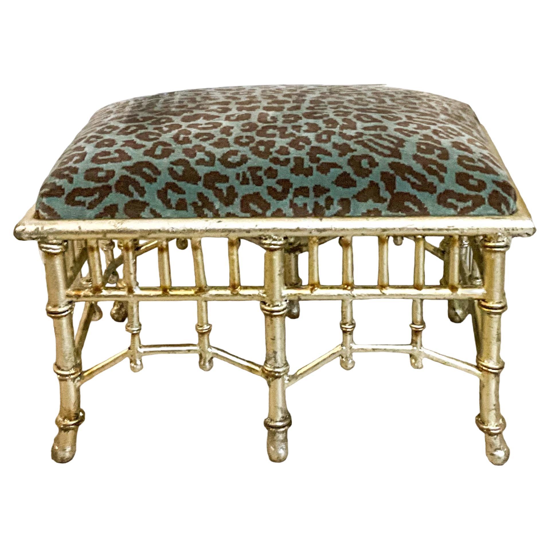 This is a 1950s Chinese Chippendale style silver gilt tole ottoman newly upholstered in a turquoise velvet. It is unmarked. It is most likely Italian.