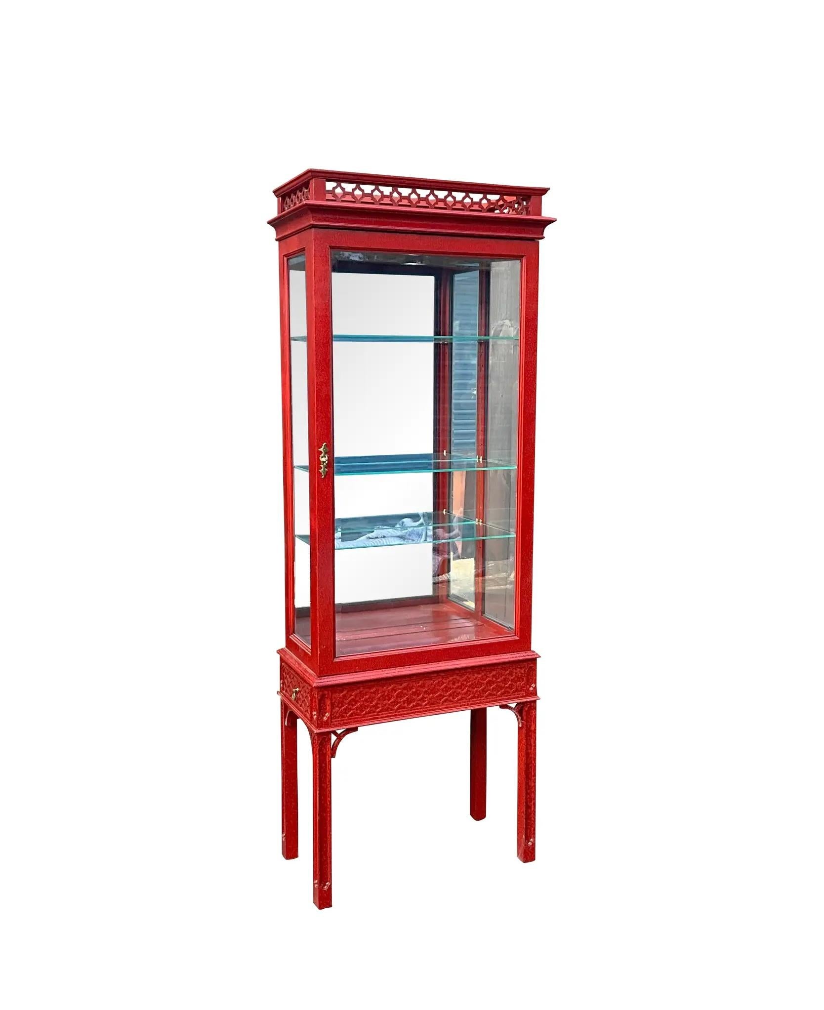 From plates to cosmetics to jewelry, make your special things stand out in these beautiful display pieces by Century Furniture. They have Chinese Chippendale styling and a two tone Chinese red painted finish with carved fretwork throughout each