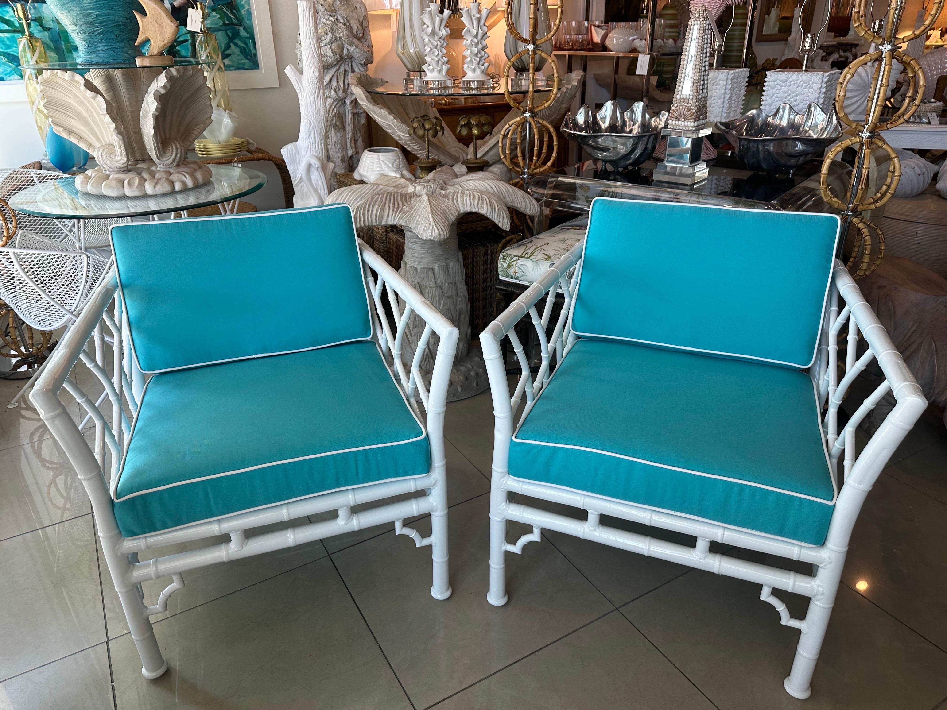 Lovely pair of vintage outdoor patio arm lounge club chairs. Newly powder-coated in a fresh white. All new cushions, including foam, upholstered in Sunbrella with a matching Sunbrella welt trim. Cushions have zippers. Dimensions: 28.5 W x 30.5 D x