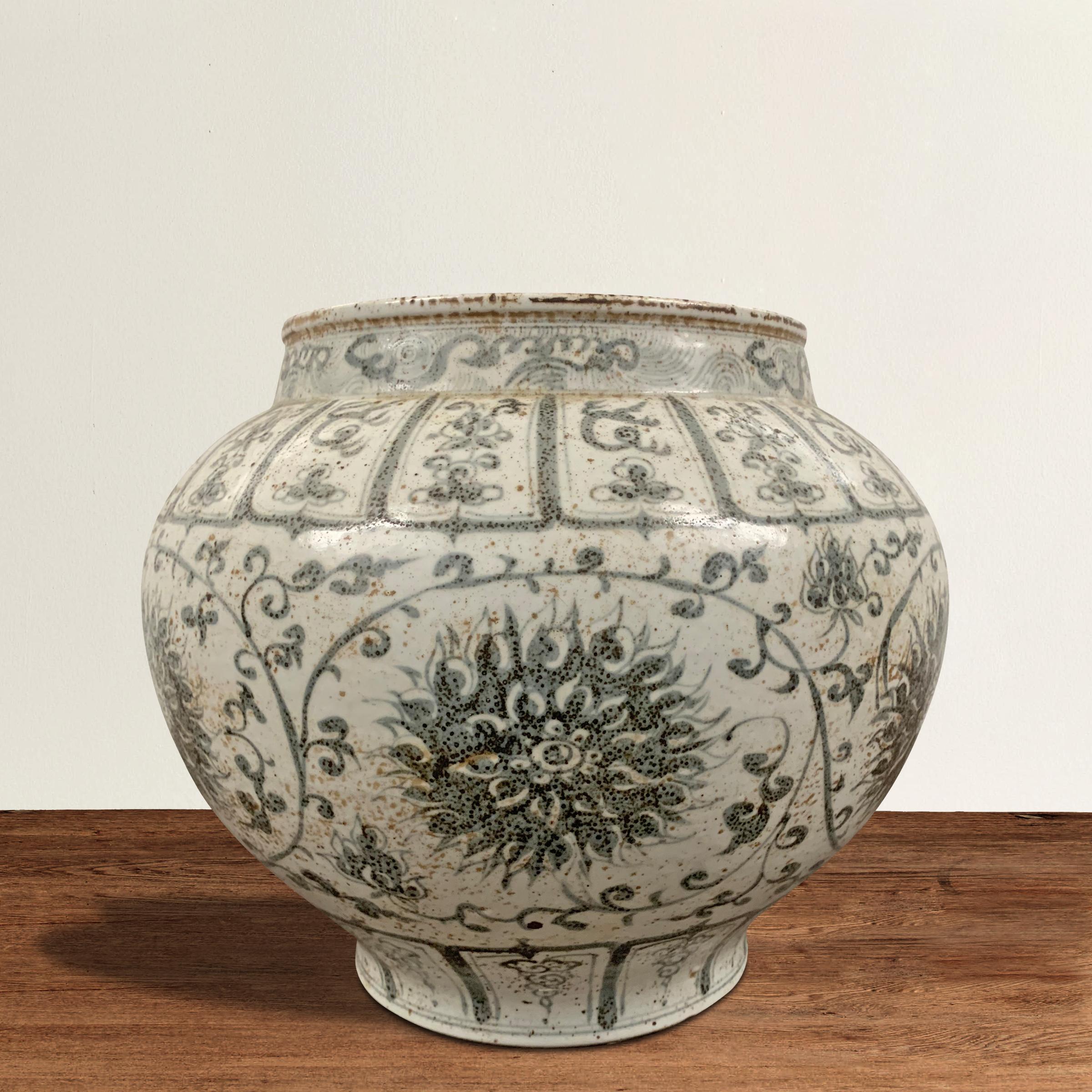 A wonderful late 20th century Chinese porcelain onion-form jar with a beautiful hand painted large-scale chrysanthemum and scrolling pattern.