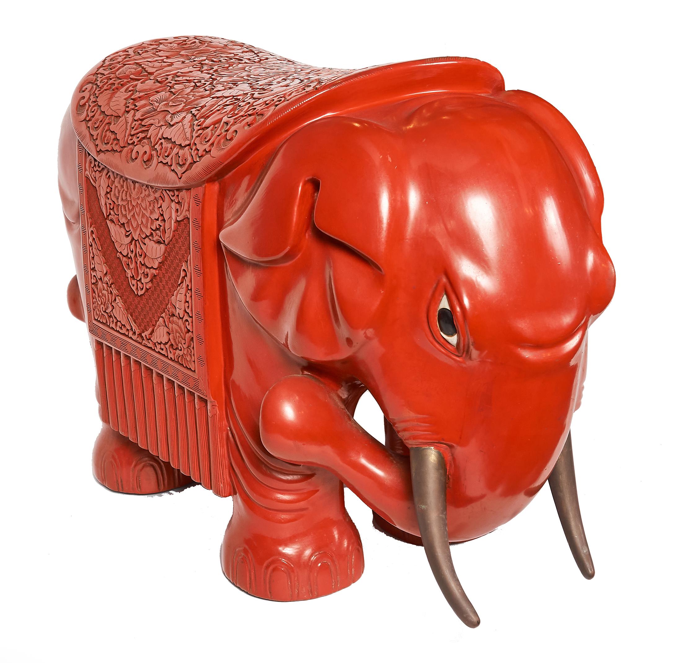 This brightly colored Asian elephant garden stool is a strong, vibrant piece to add to any indoor or outdoor area. Exquisitely carved, this red cinnabar elephant is a regal addition to an Asian art collection or modern home and is fully functional